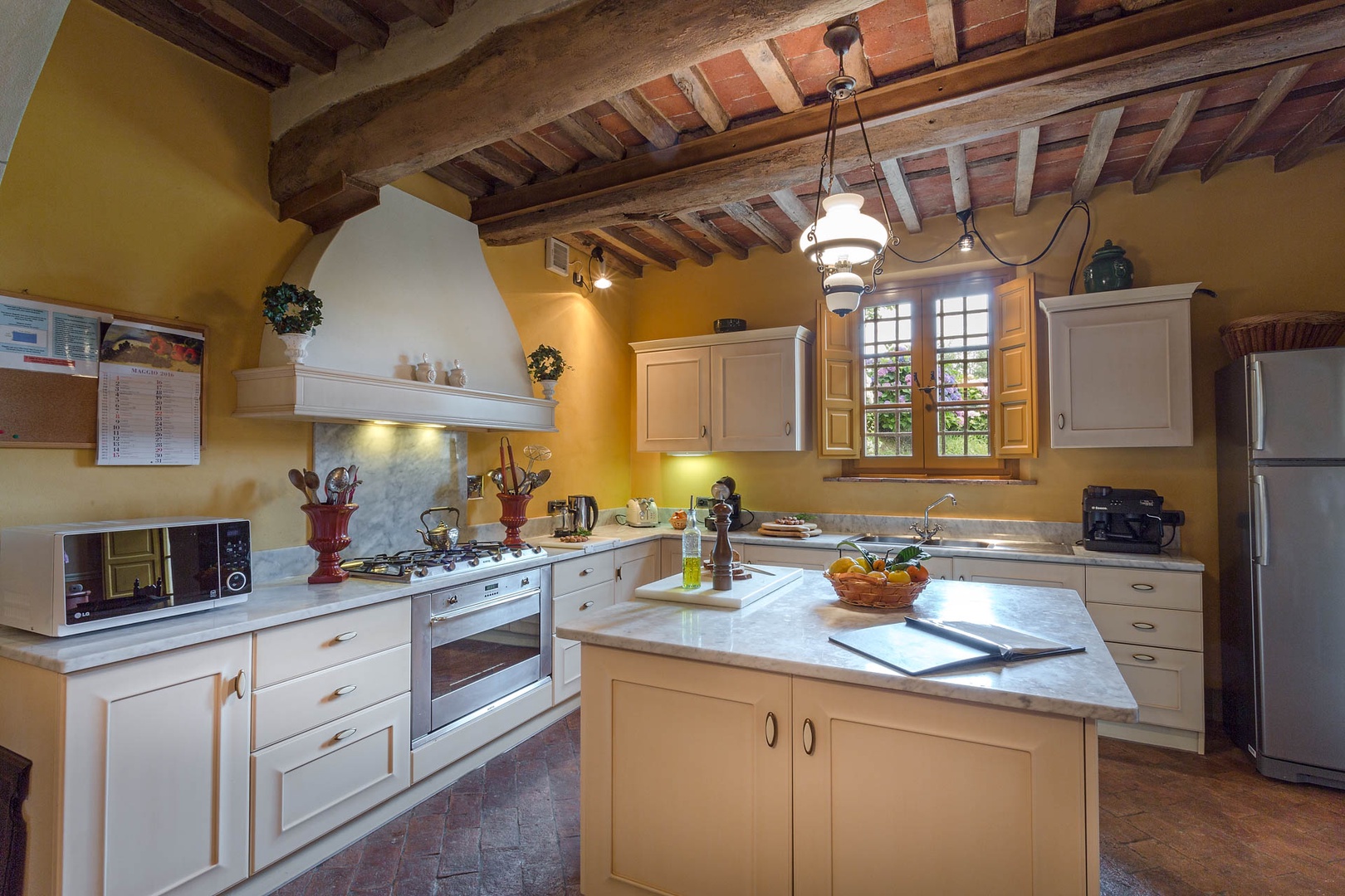 Fully equipped kitchen with a center island perfect for cooking lessons