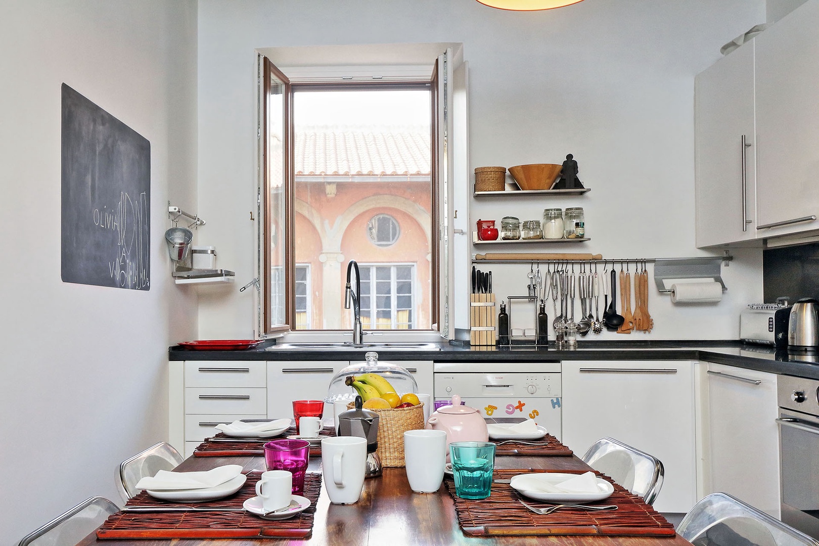 Nice view of the attractive buildings the area from the large kitchen window over the sink.