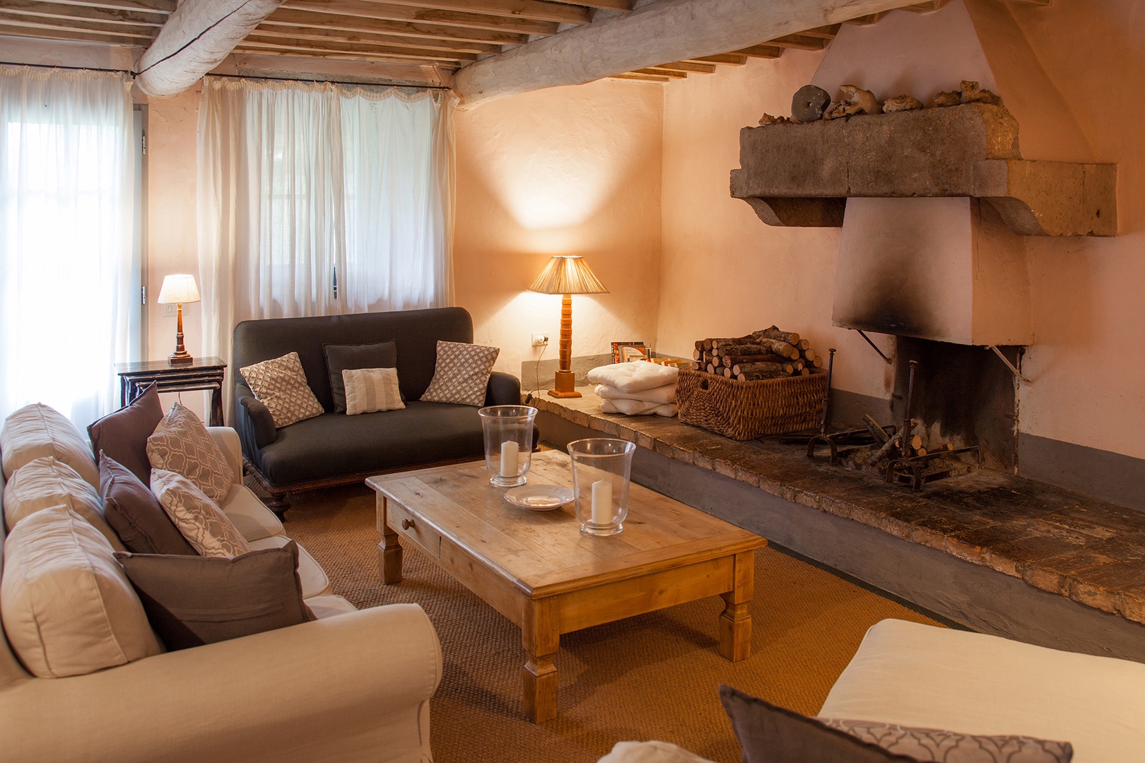 Terrace doors in the living room open to the expansive lawn. Cozy fireplace for winter months.