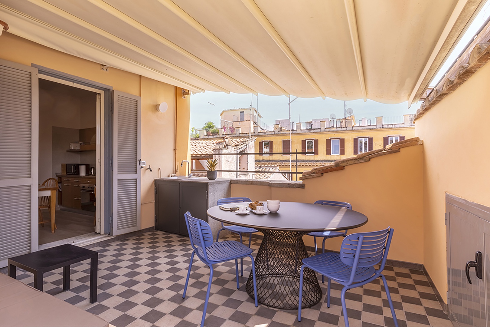 Covered dining area is a lovely touch!