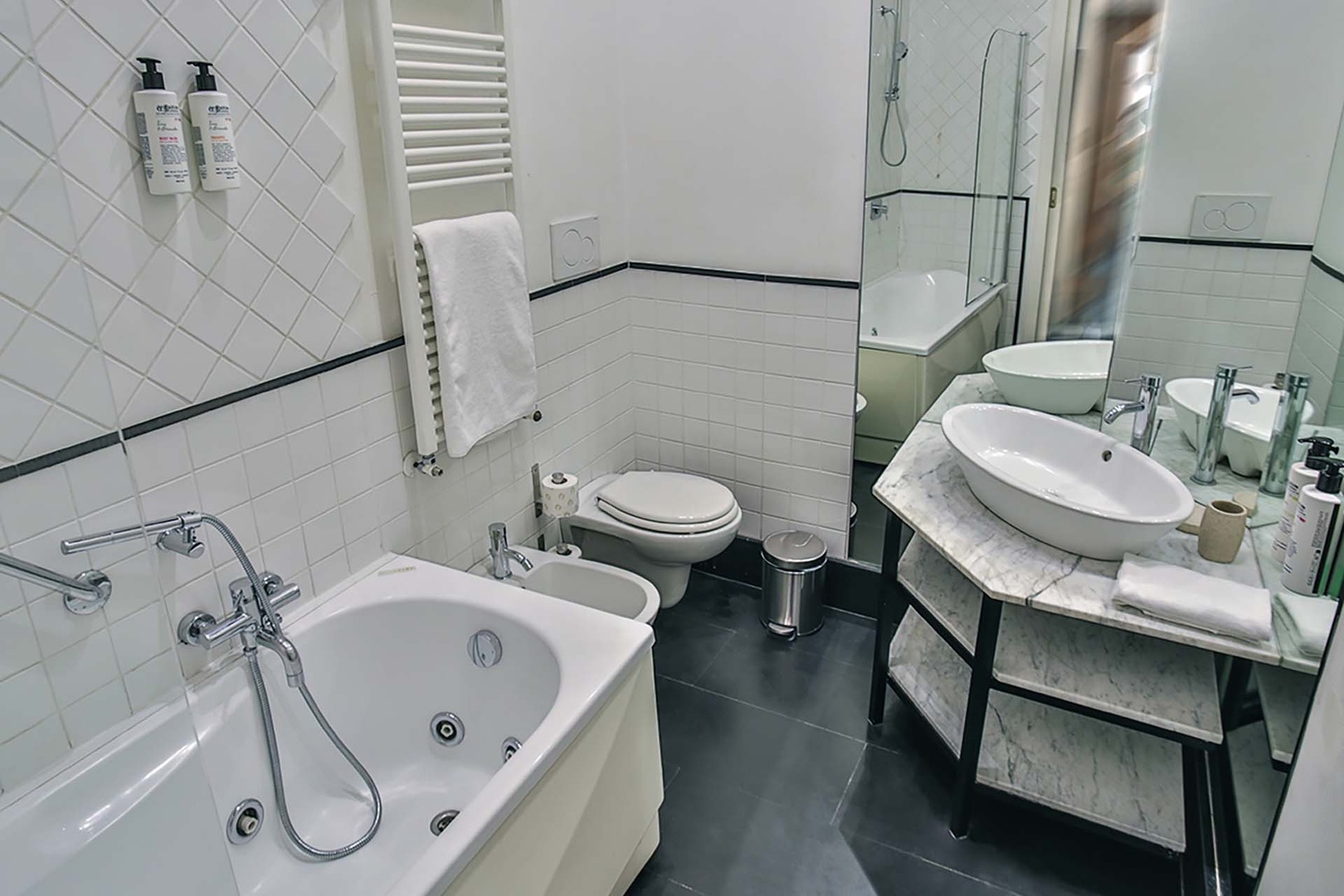 En suite bathroom for bedroom 3 is clean and modern.