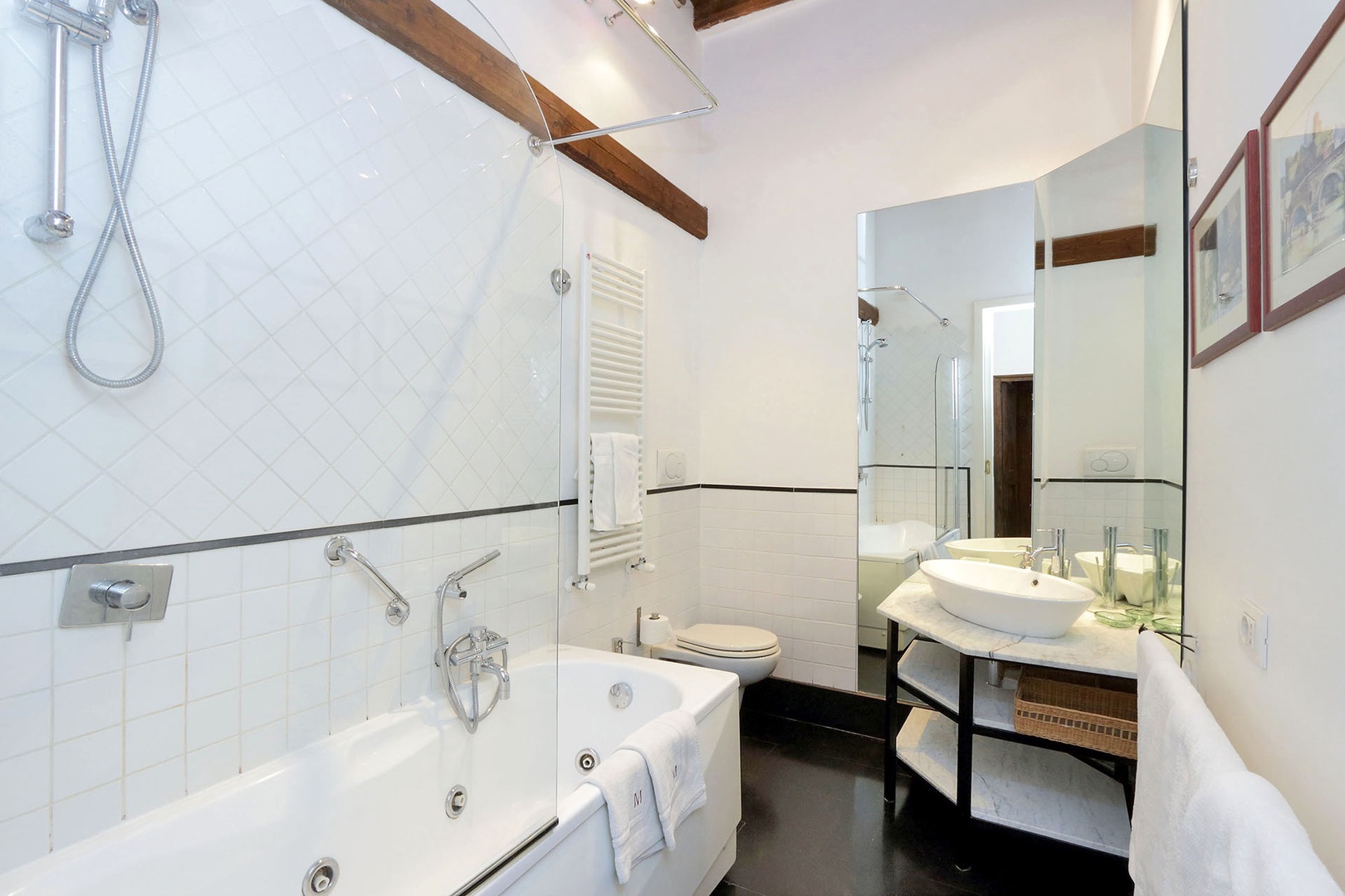 En suite bathroom for bedroom 1 is clean and modern.