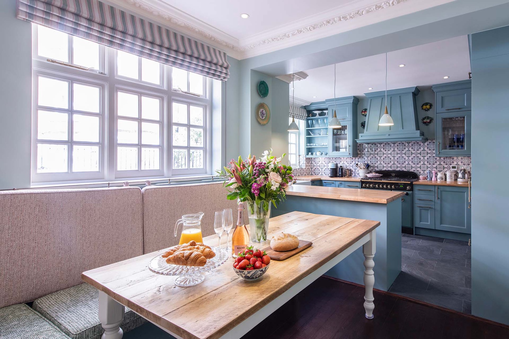 Lovely light fills the kitchen with custom dining nook.