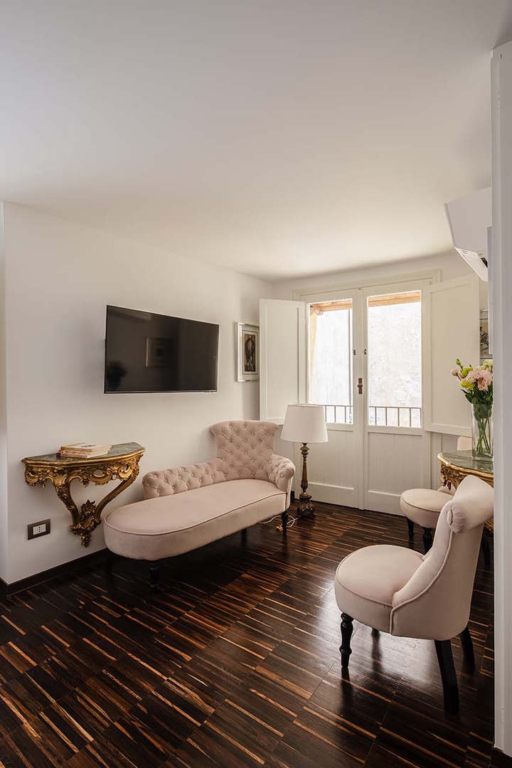 Elegant sitting area in bedroom 2.