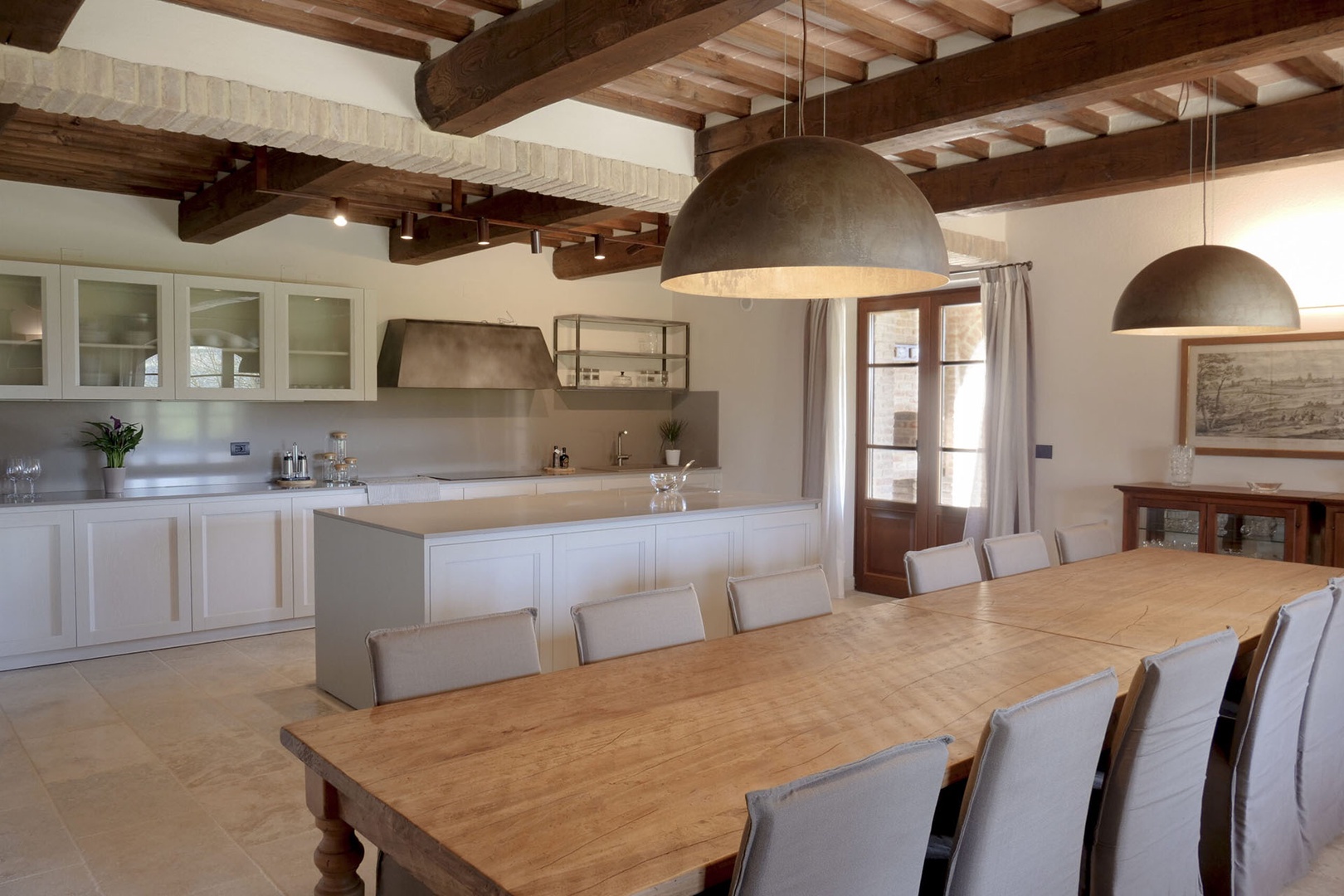 Grand modern kitchen with large dining table.