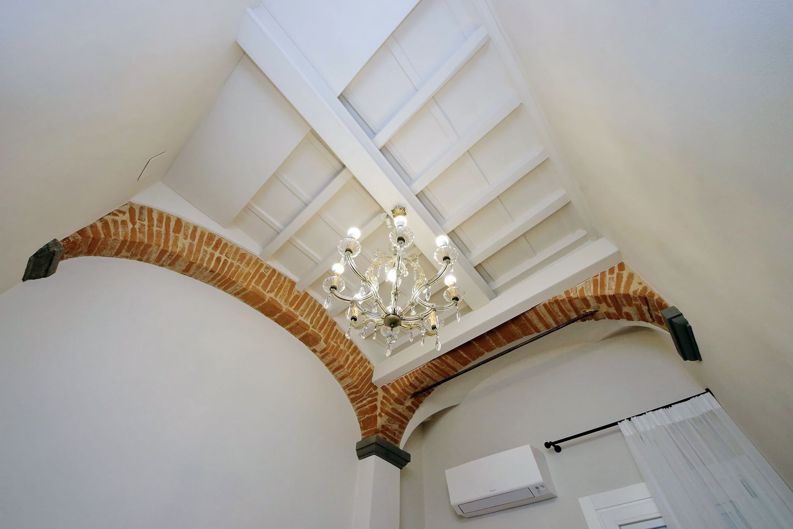 Beamed ceilings in the office area and throughout the apartment.