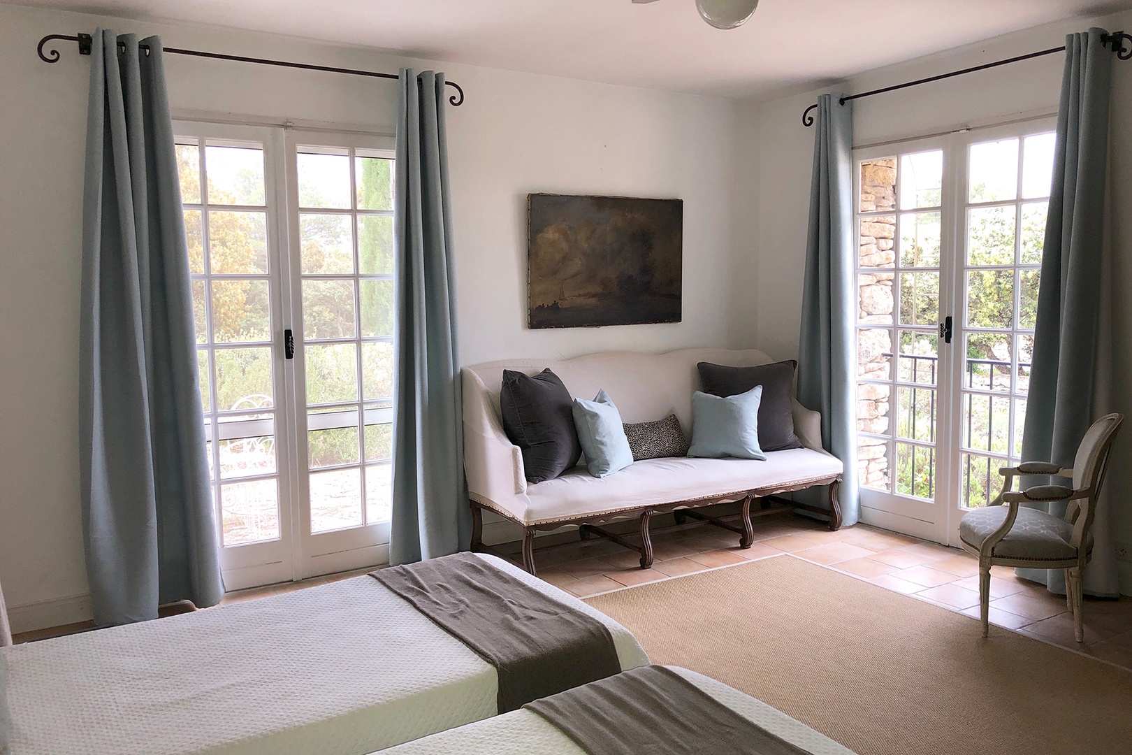 French doors fill bedroom 1 with beautiful light