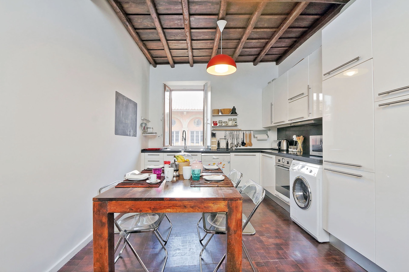 Fully equipped kitchen with dining table.