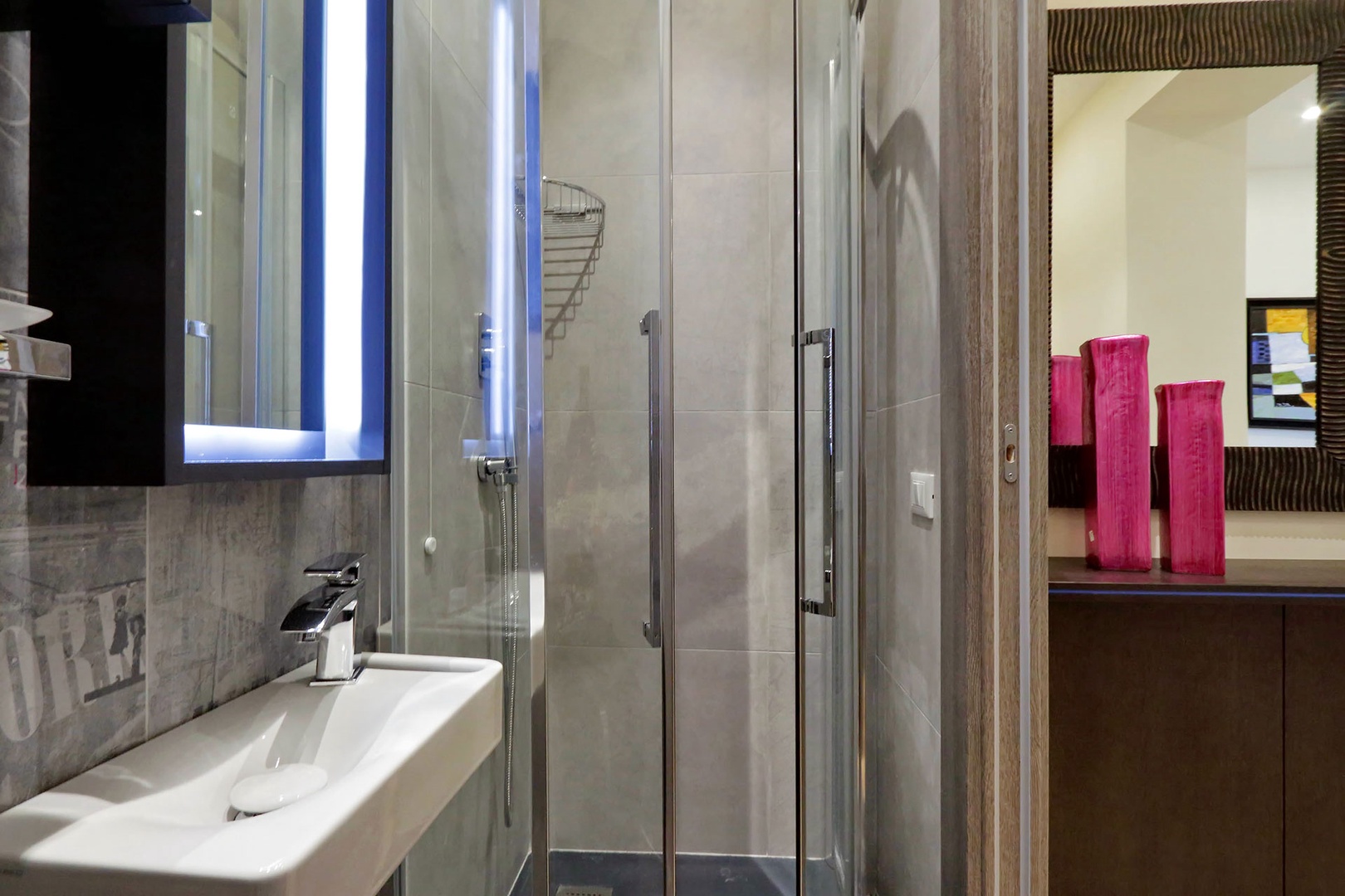 Bathroom 3 has shower, toilet and sink.