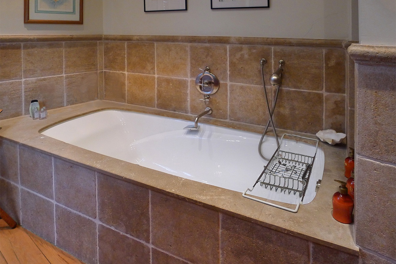 Enjoy a relaxing soak in this luxurious bathtub.