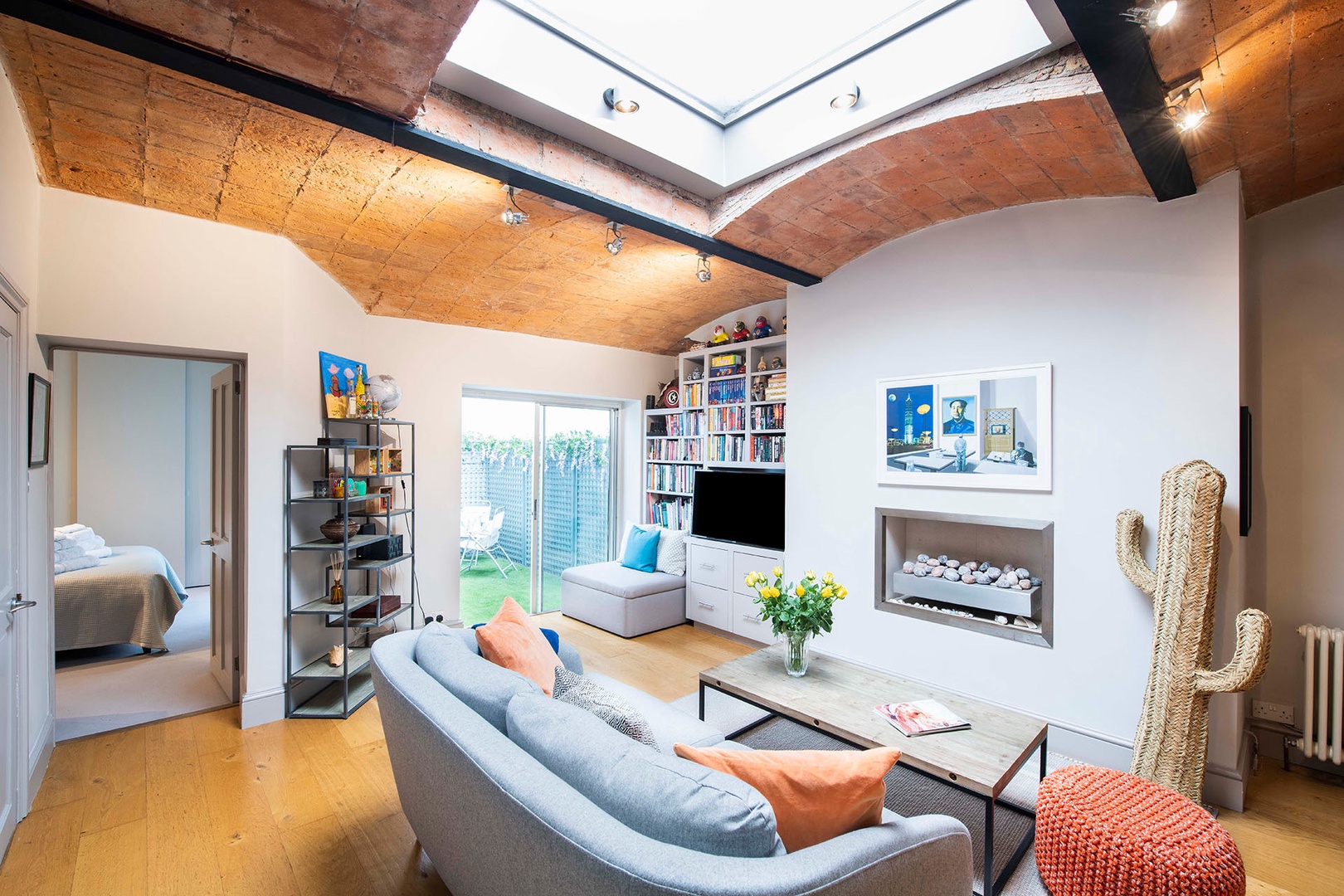 Light fills the living room from the large skylight.