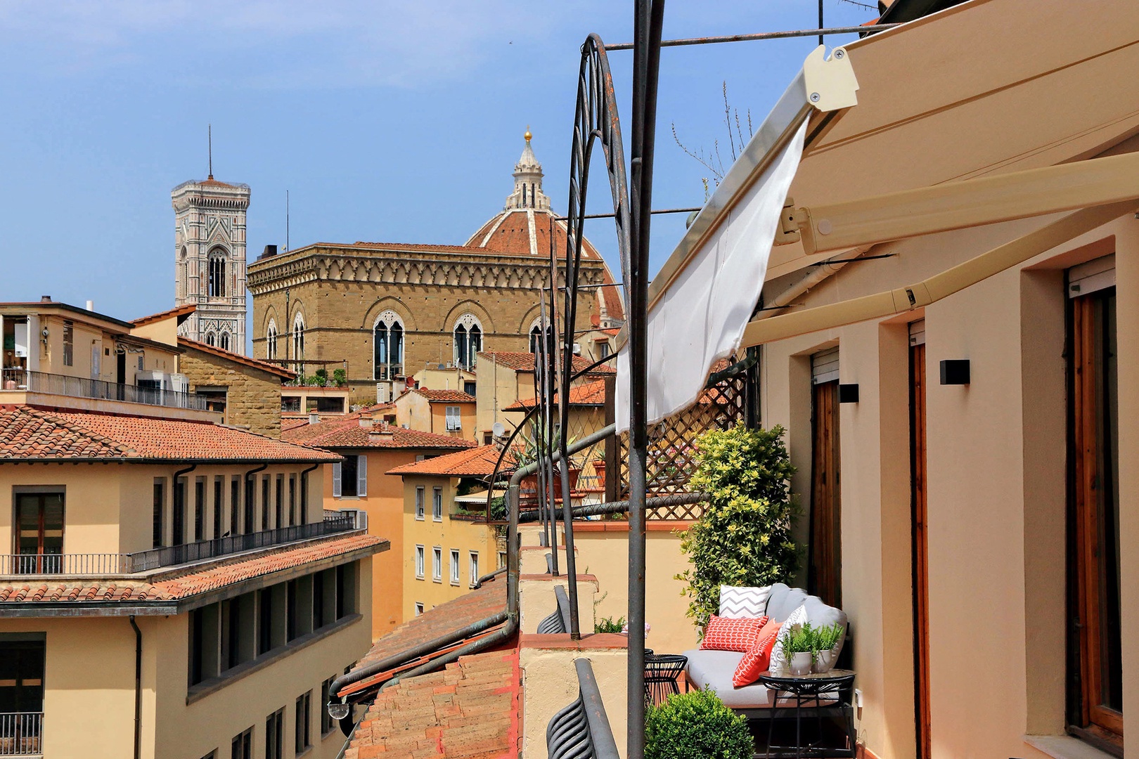 Large balcony with lovely views of the rooftops and historic sights of Florence.