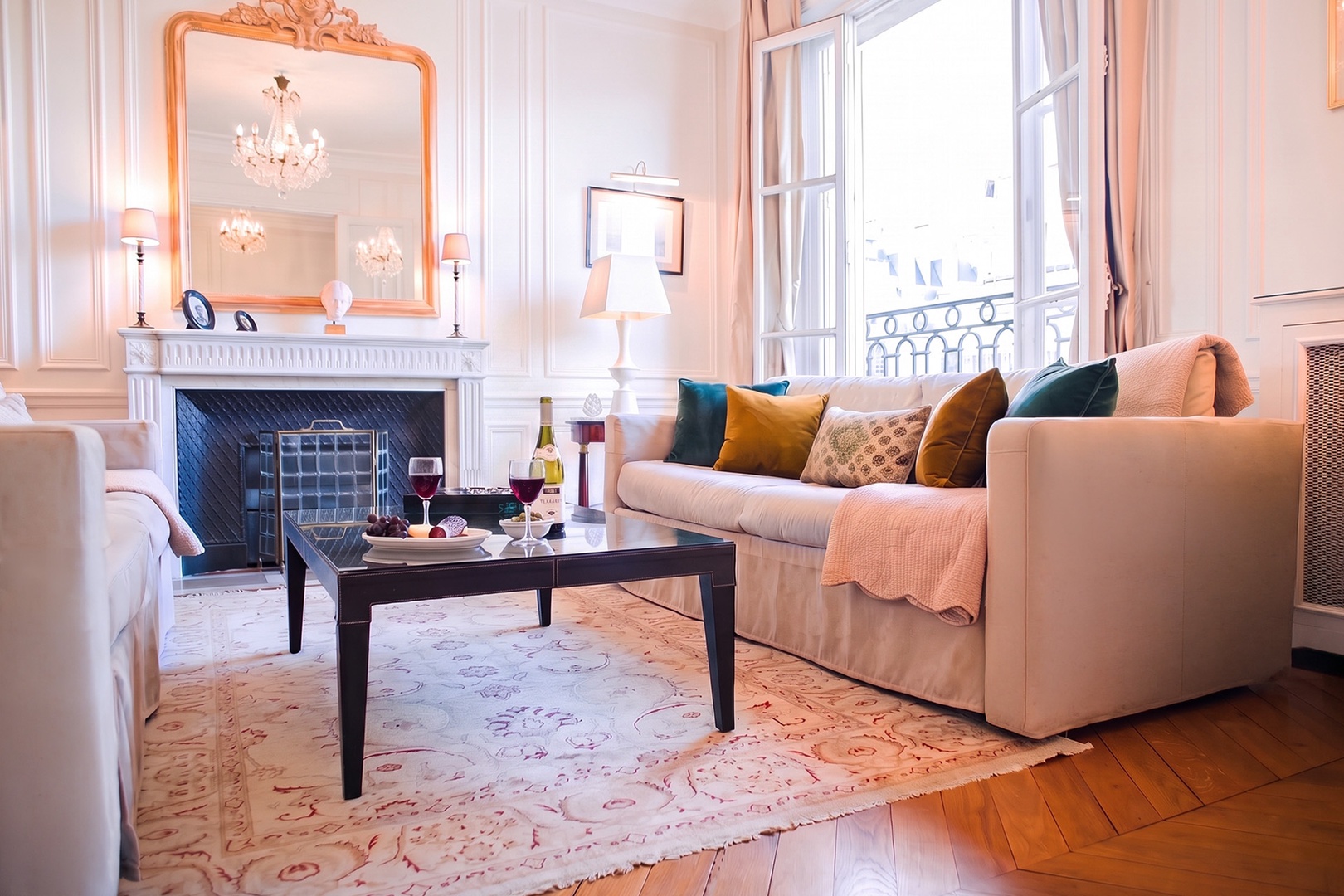 Sunlight streams into the living room through lofty French windows.
