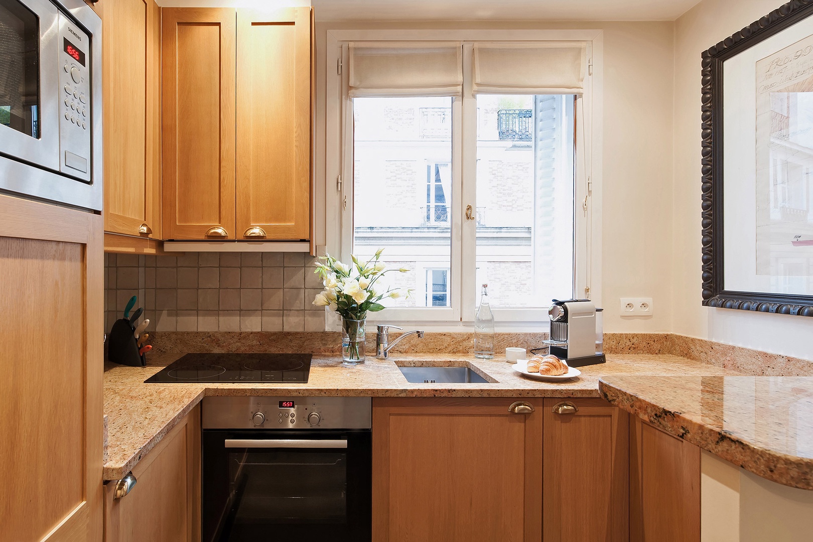 Enjoy cooking in this modern designer kitchen with cherrywood and granite.