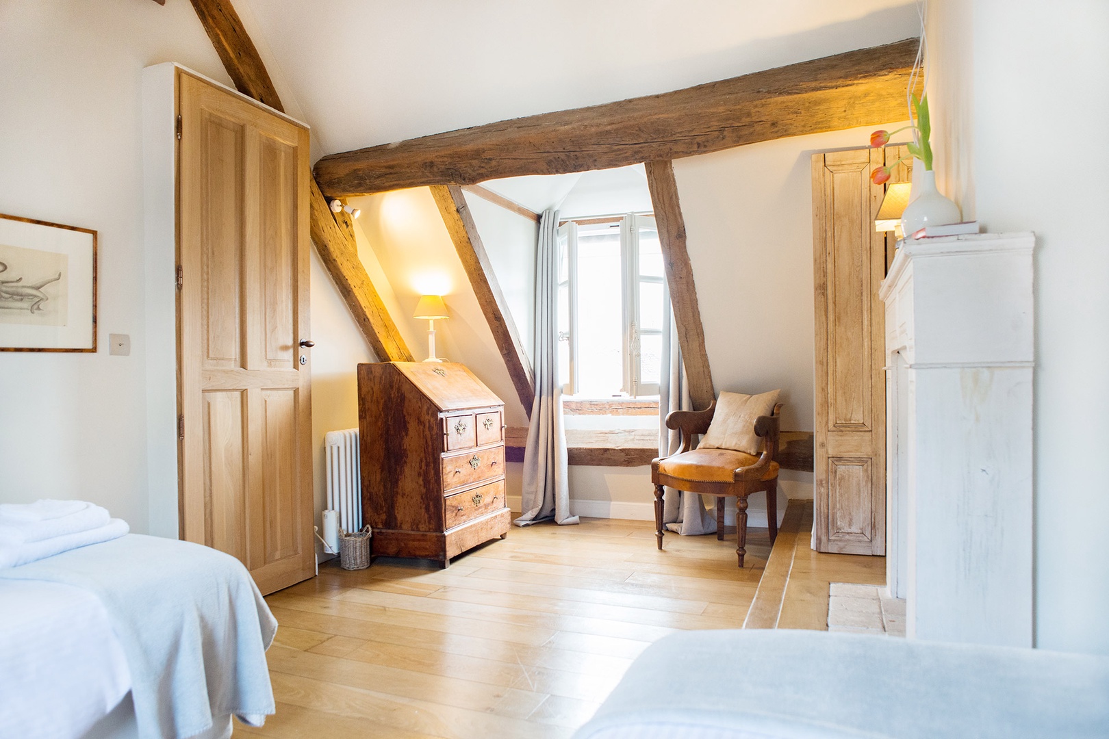 The oak beams and slanting ceiling continue in bedroom 2.
