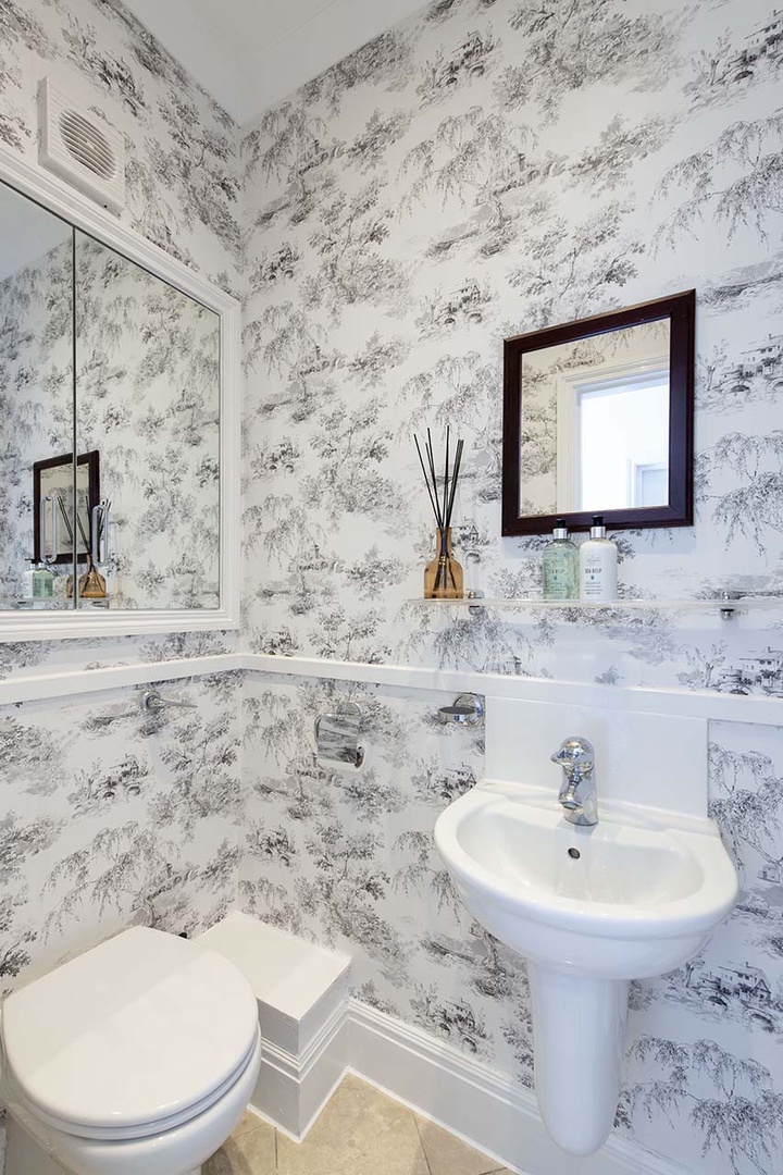 Charming half bathrooms on first floor.