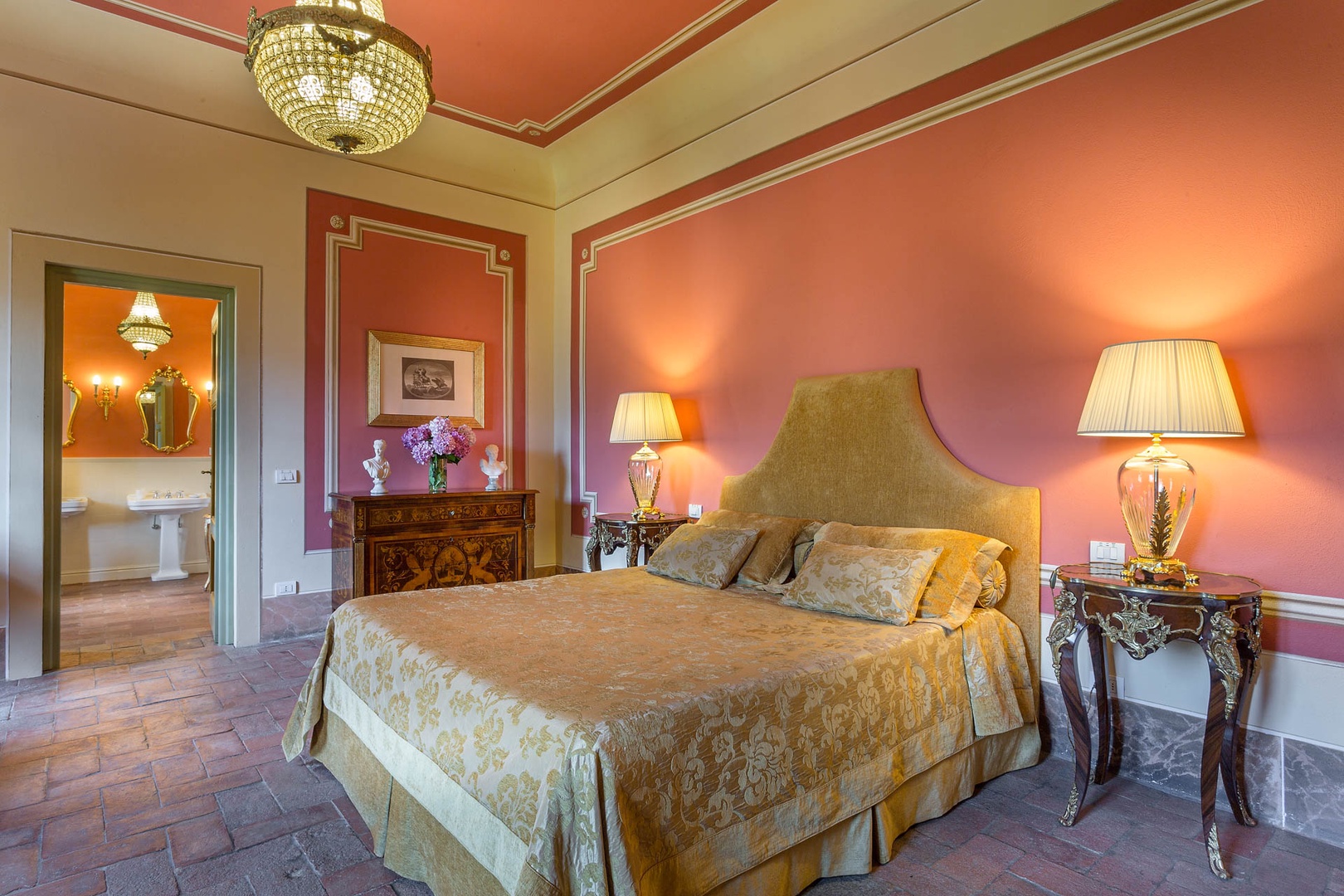 Warm and rich toned bedroom with sitting area