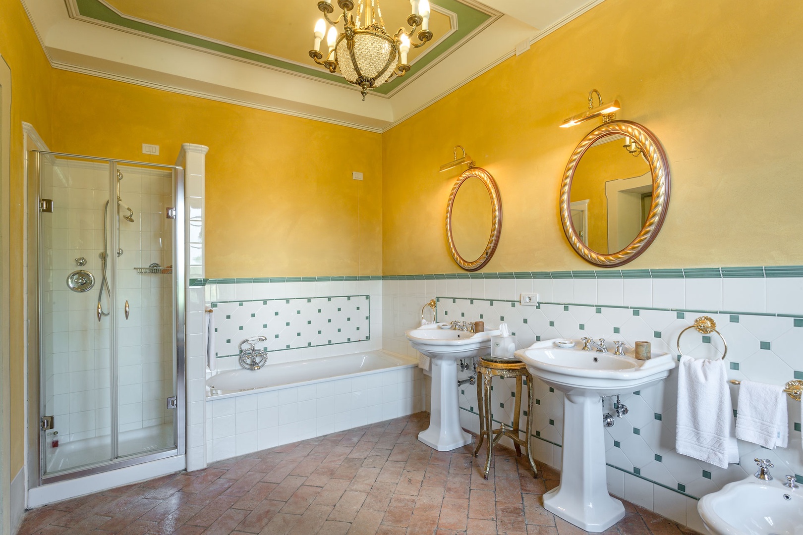 En suite bathroom with bathtub and shower