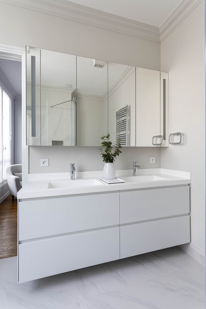 En suite features a double sink, toilet and shower.