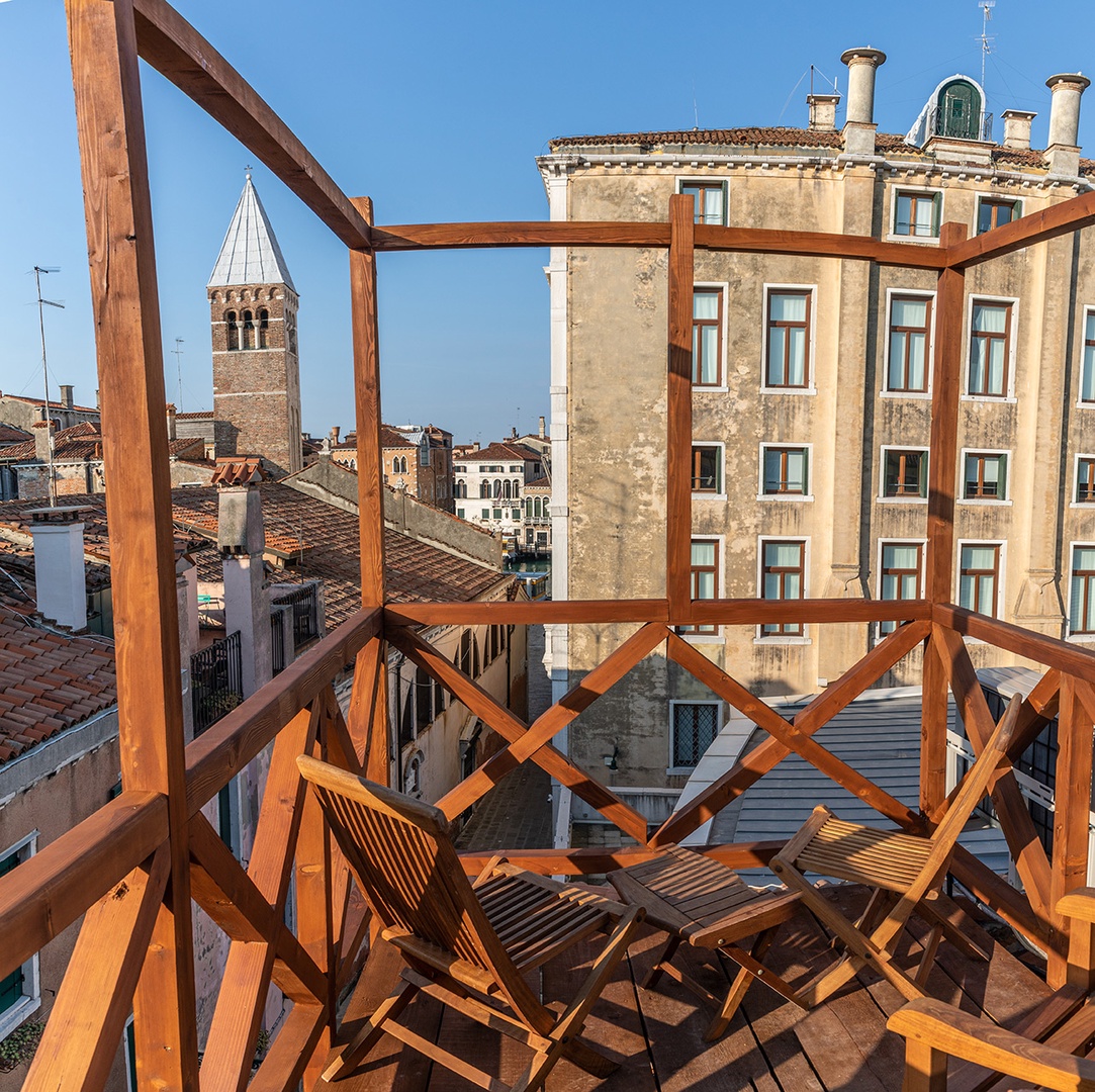 Enjoy views looking out towards campanile of San Samuele and Palazzo Grassi from the rooftop terrace