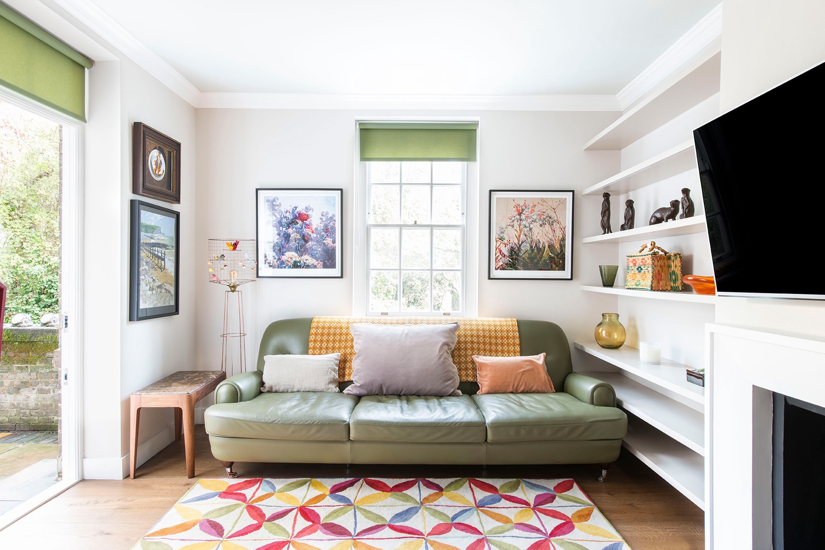 The living room is full of light and opens to private patio.