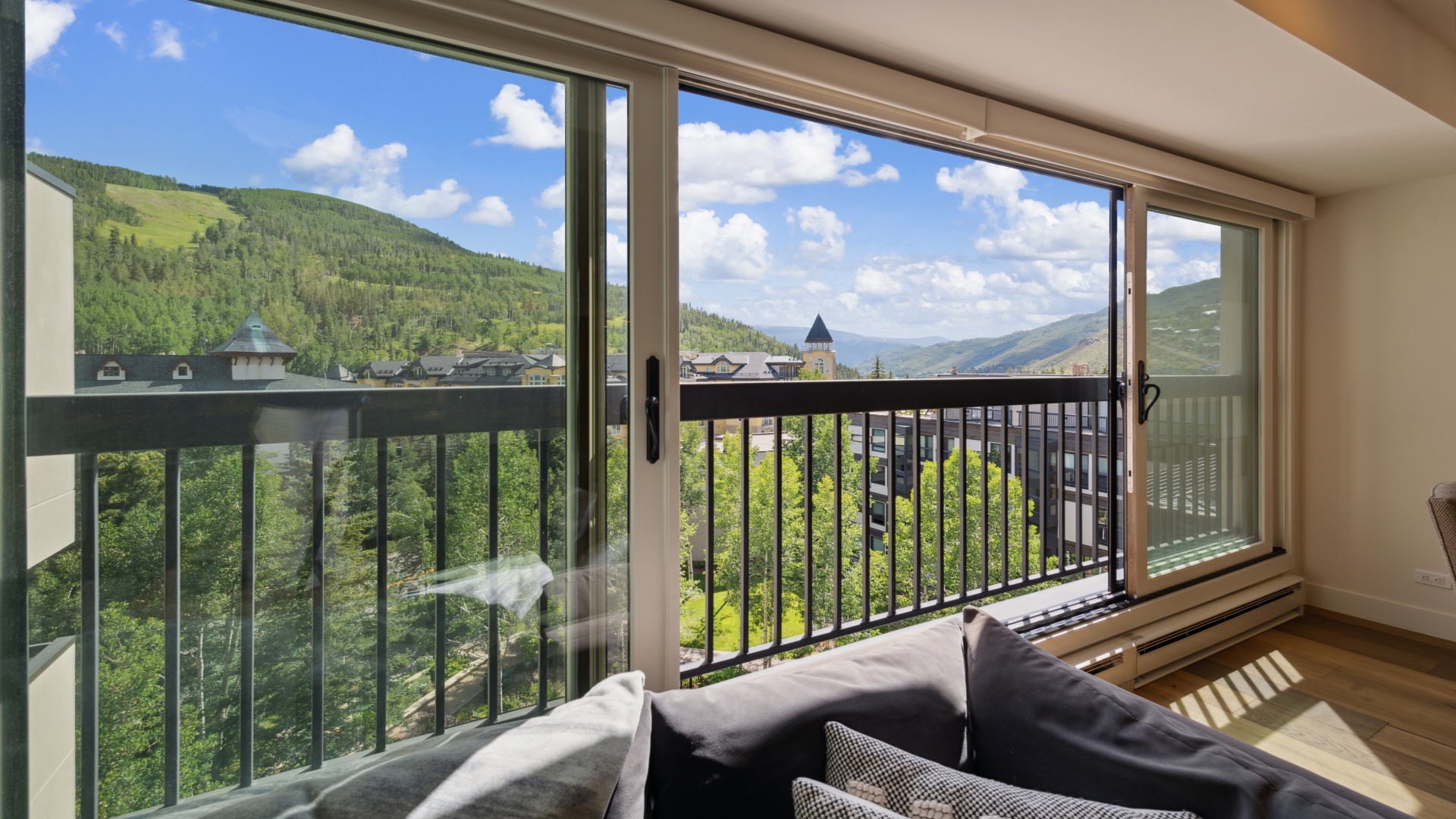 You'll love the sweeping mountain views from your private balcony, where lush forests meet blue skies and nearby villages dot the valley below—a serene spot to unwind with morning coffee or evening relaxation.