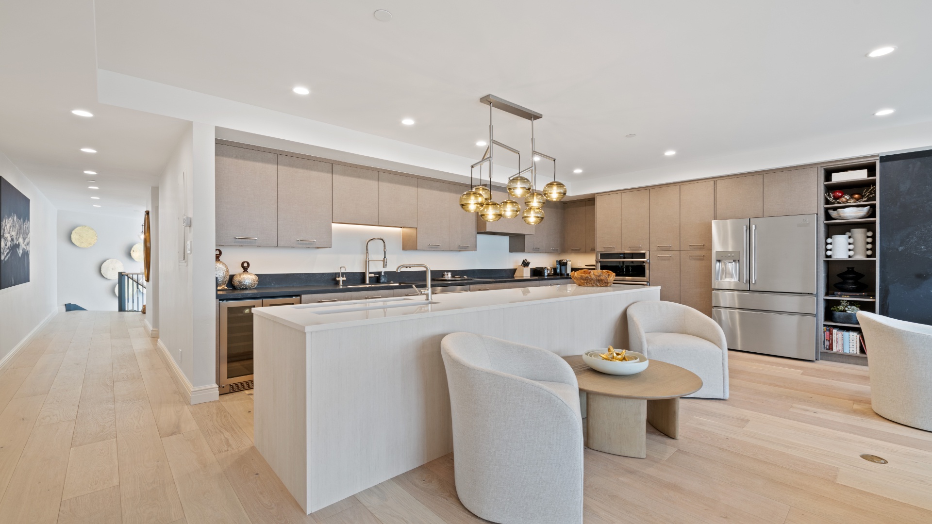 Your gourmet kitchen features sleek cabinetry, granite countertops, stainless steel appliances, and a center island perfect for casual dining or meal prep.