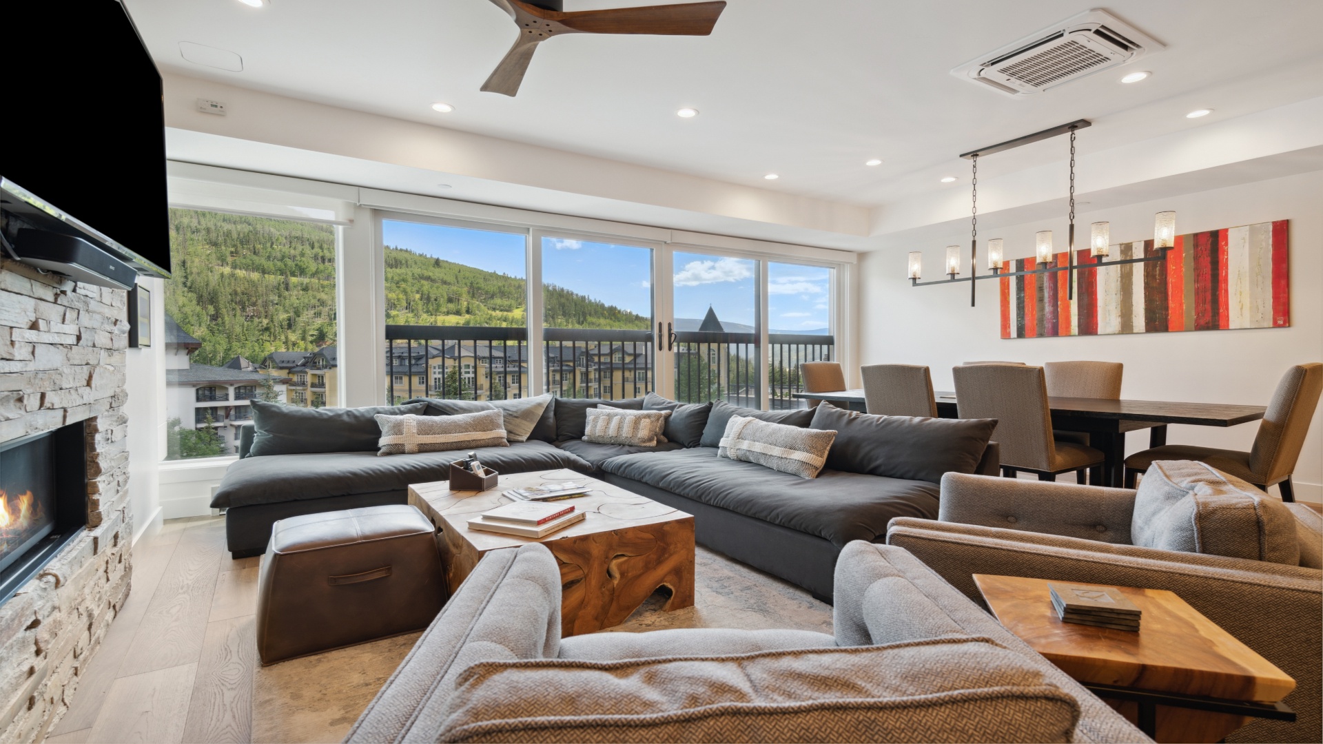 Sink into plush seating with mountain vistas framing your stay. Your modern retreat features a cozy fireplace, dining for eight, and a balcony where fresh alpine air awaits.