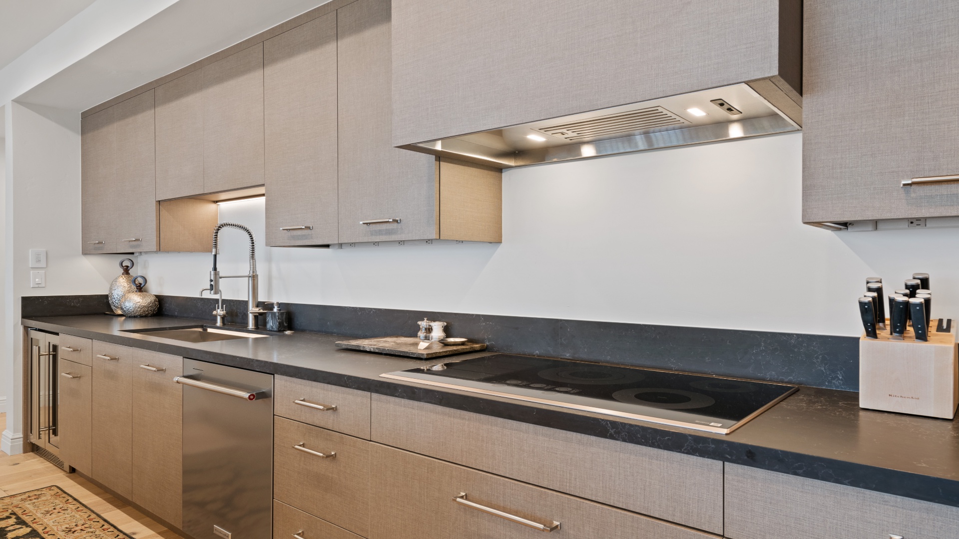 A sleek, modern kitchen awaits you with gleaming countertops, professional-grade appliances, and ample space to prepare your favorite meals in style.