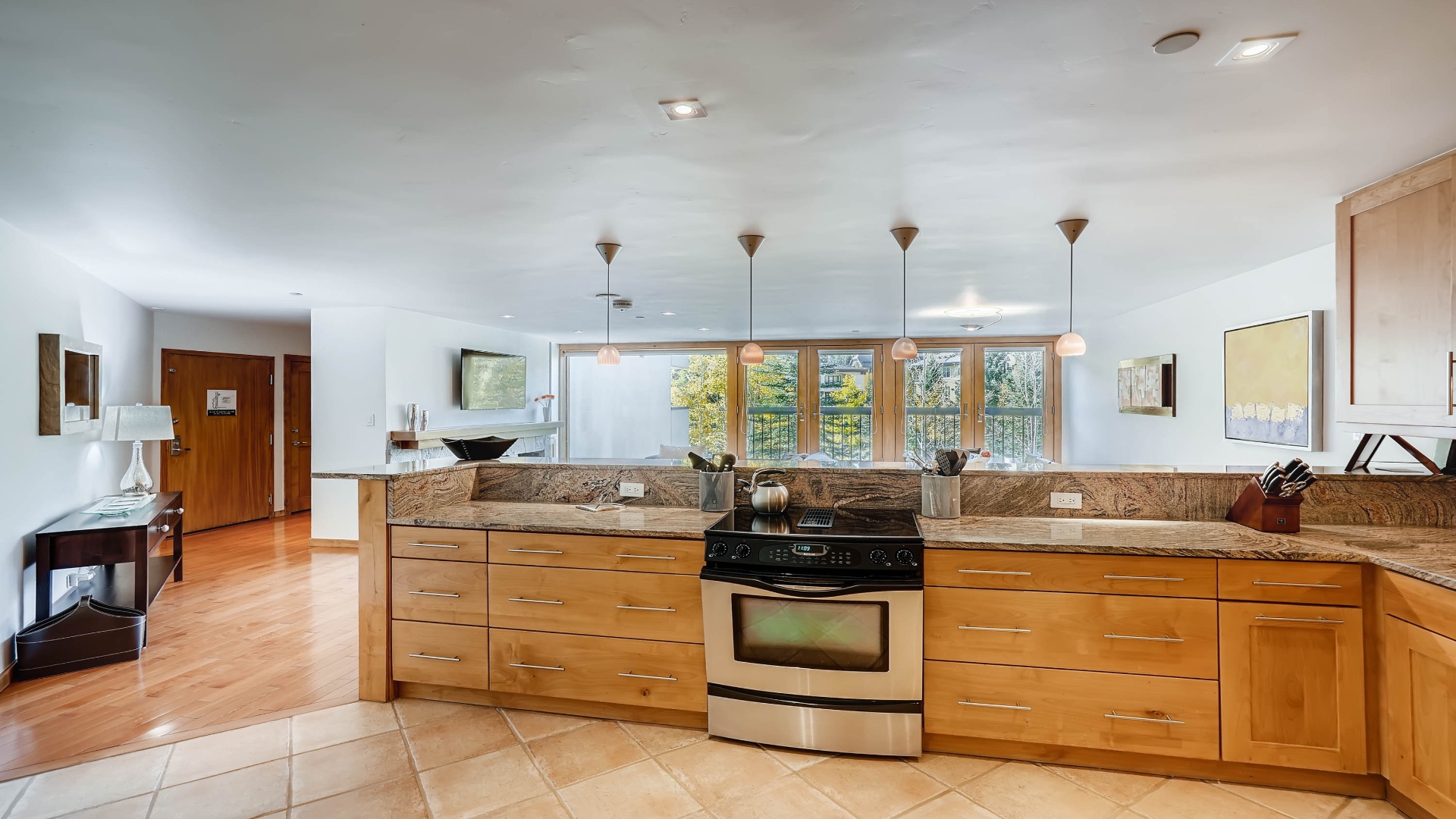 Step into your bright, fully-equipped kitchen with marble countertops, modern appliances, and natural light. Cook your favorite meals while enjoying peaceful views through the large windows—this inviting space is ready for your arrival.