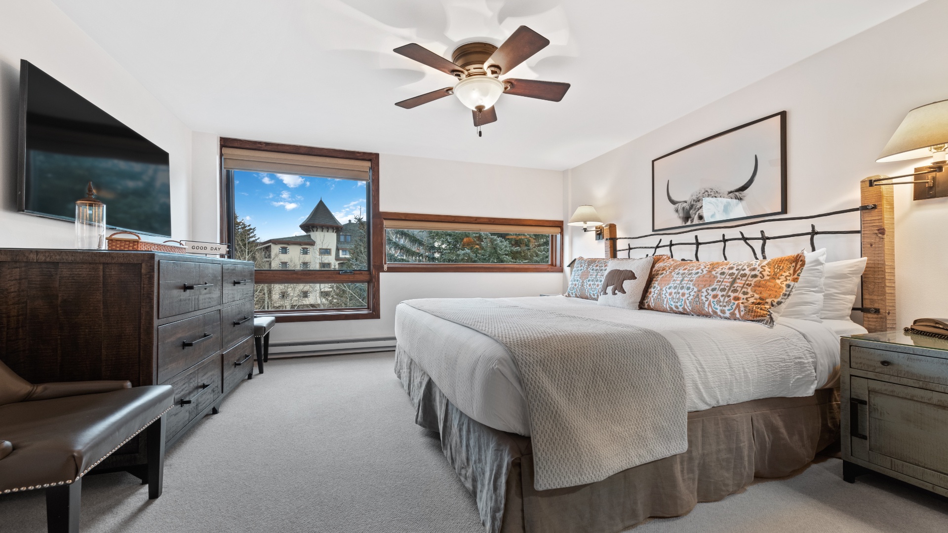 Sink into cozy comfort in your mountain-view bedroom, where rustic elegance meets modern convenience. Wake up to fresh alpine air and scenic views through expansive windows.