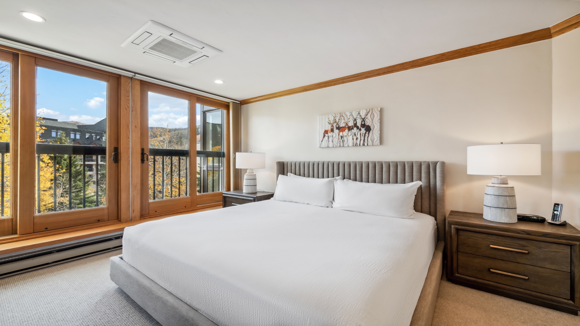 Wake up to mountain scenery framed by warm wooden windows. Your peaceful retreat features a plush bed, modern climate control, and serene natural light to start each morning refreshed.
