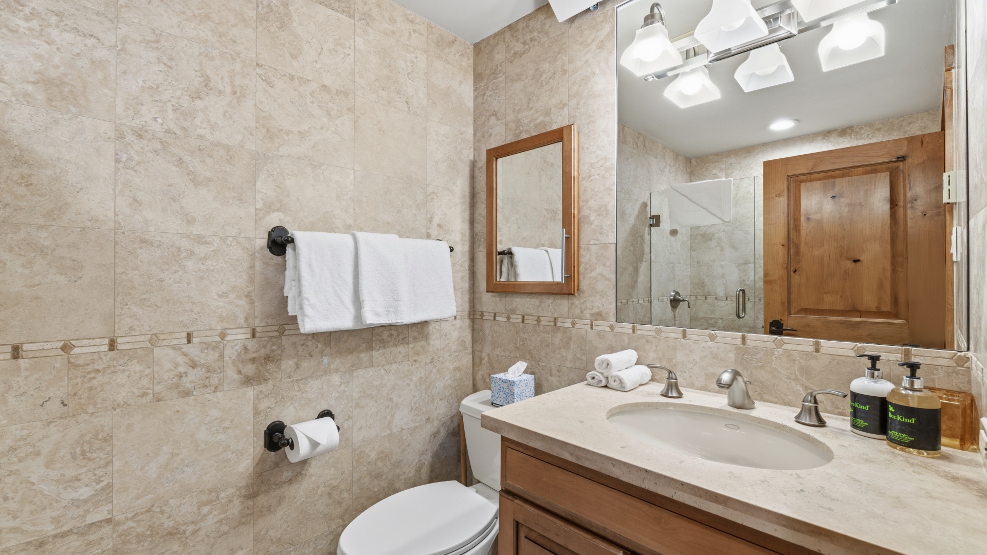 Your private bathroom features elegant tile work, fresh towels, and modern fixtures—everything you need to refresh after a day of adventure.