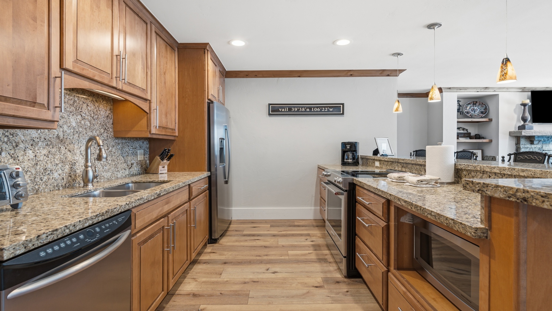 Picture yourself preparing meals in this spacious kitchen with granite countertops, stainless appliances, and abundant cabinet storage—everything you need to feel at home.