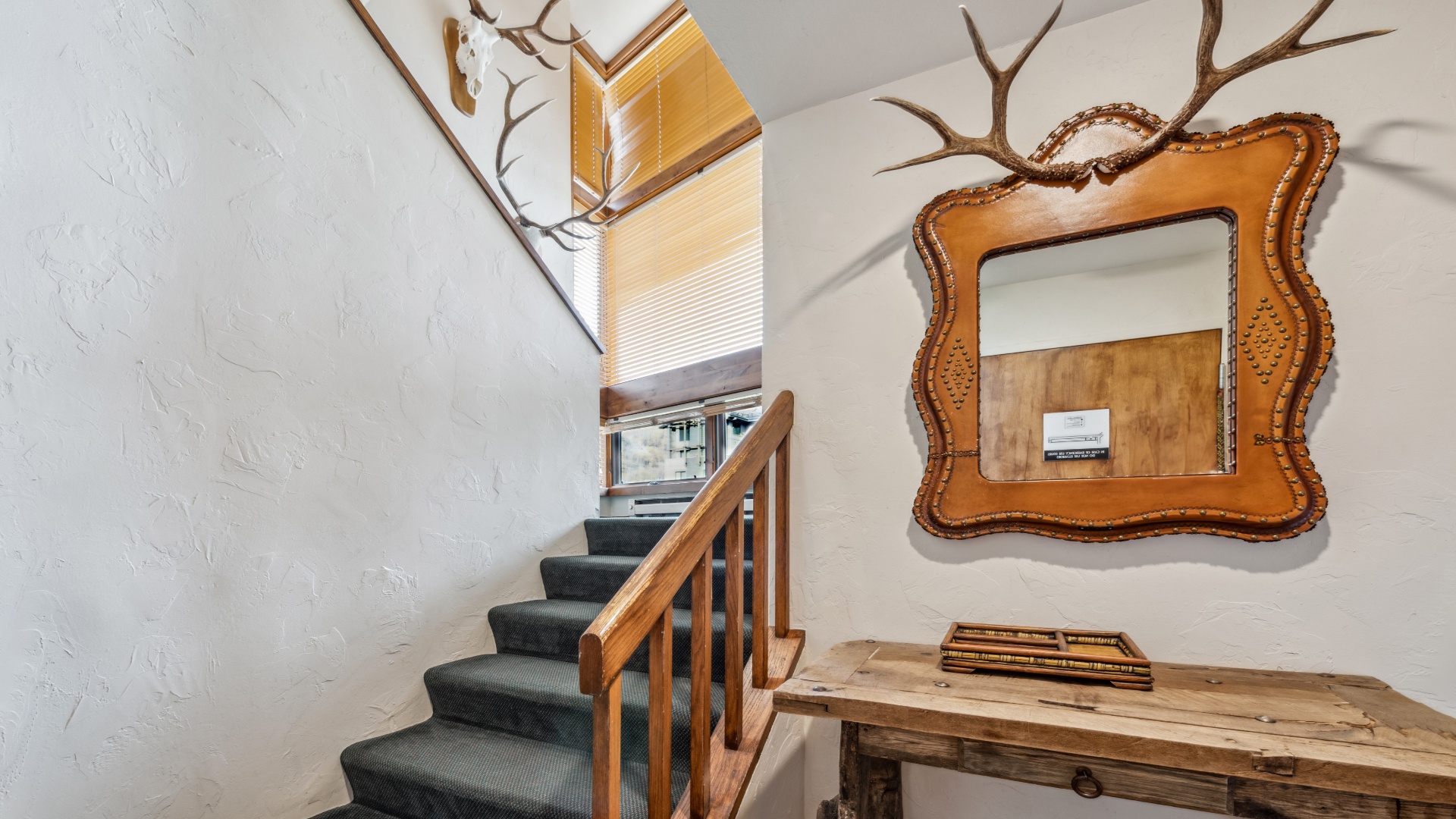 Step into a warm, character-filled entryway with rustic charm and unique artisan touches that set the tone for your mountain retreat.