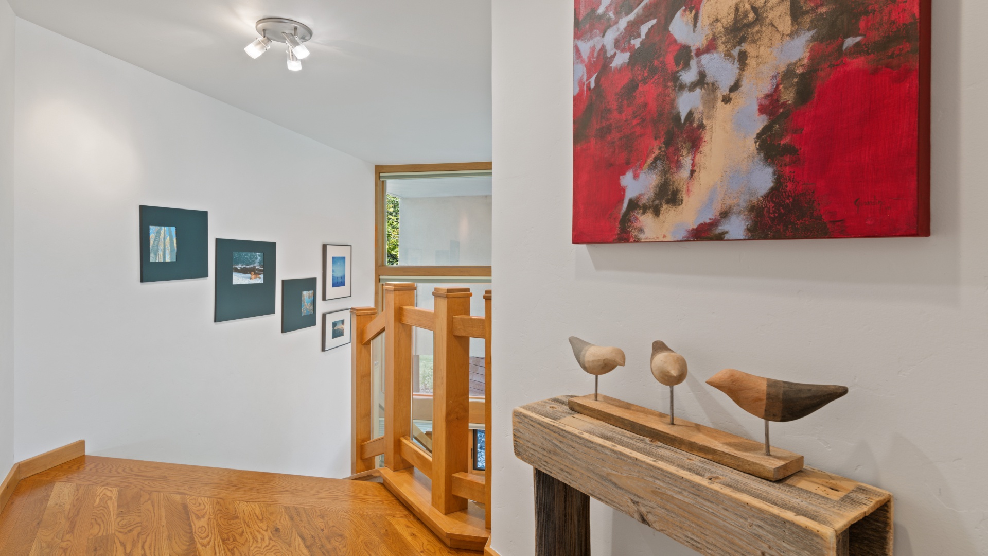 Step into an artful hallway where vibrant paintings and sculptural accents set a creative, welcoming tone for your stay—each detail thoughtfully chosen to inspire.