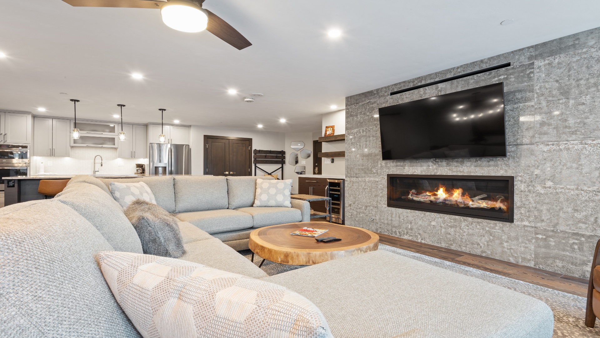 Sink into plush sectionals by the cozy fireplace, where modern comfort meets mountain elegance—perfect for unwinding after your day of adventure.