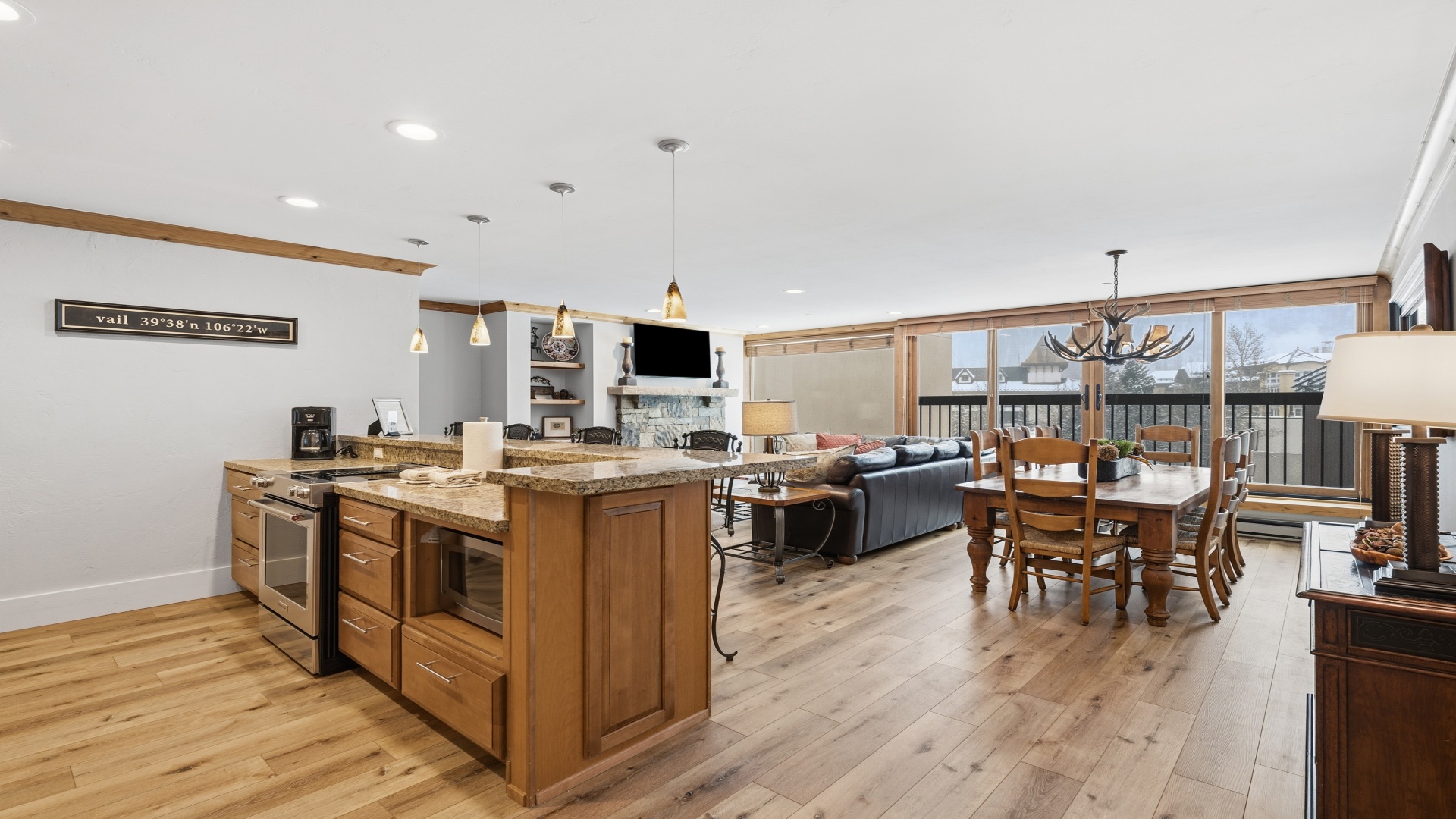 Gather in your bright, open-plan living area with a fully equipped kitchen, cozy fireplace, and dining space perfect for making memories together.