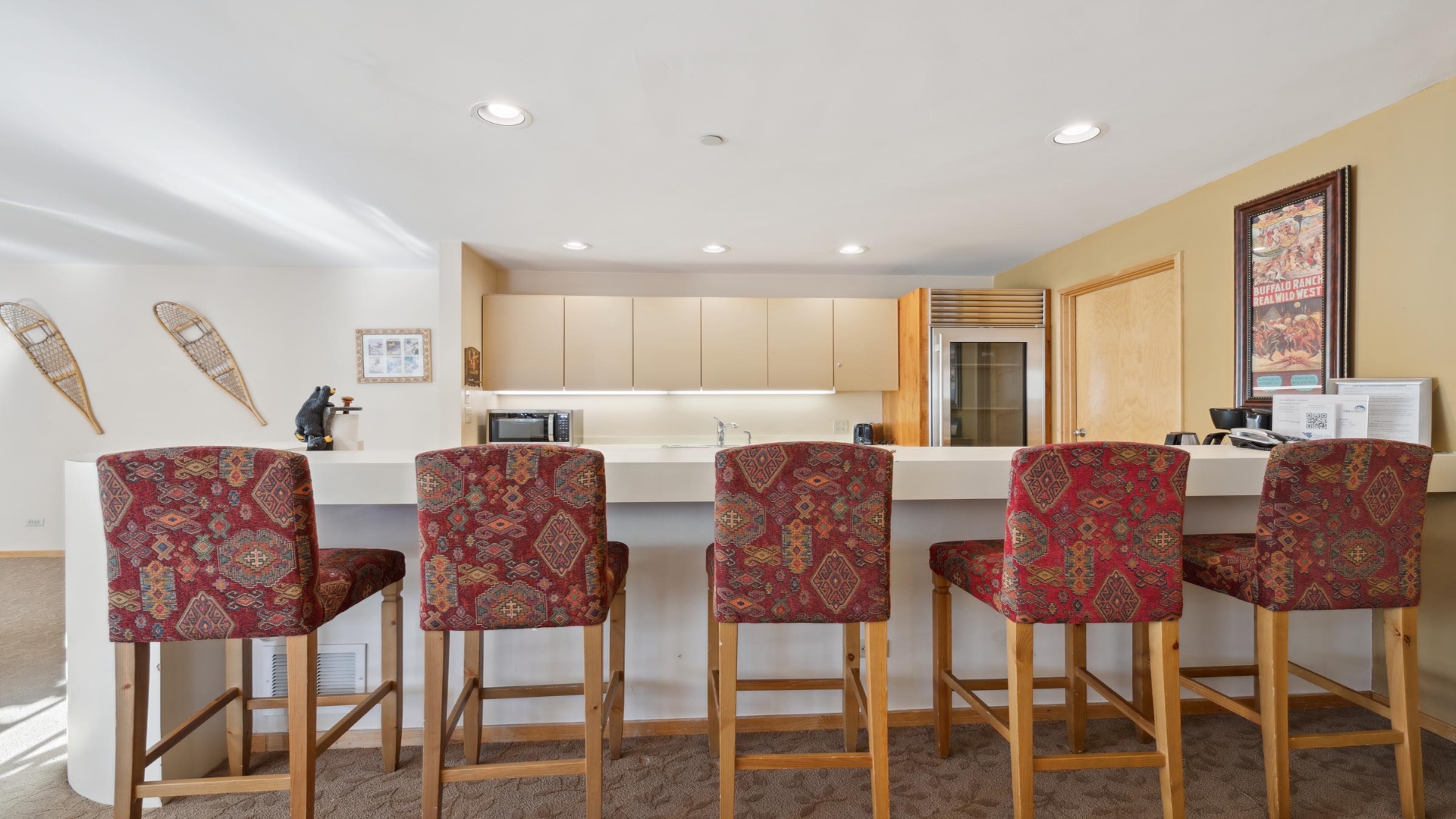 Gather around the breakfast bar for morning coffee or casual meals. Stylish upholstered stools and gleaming countertops create the perfect spot to start your day together.