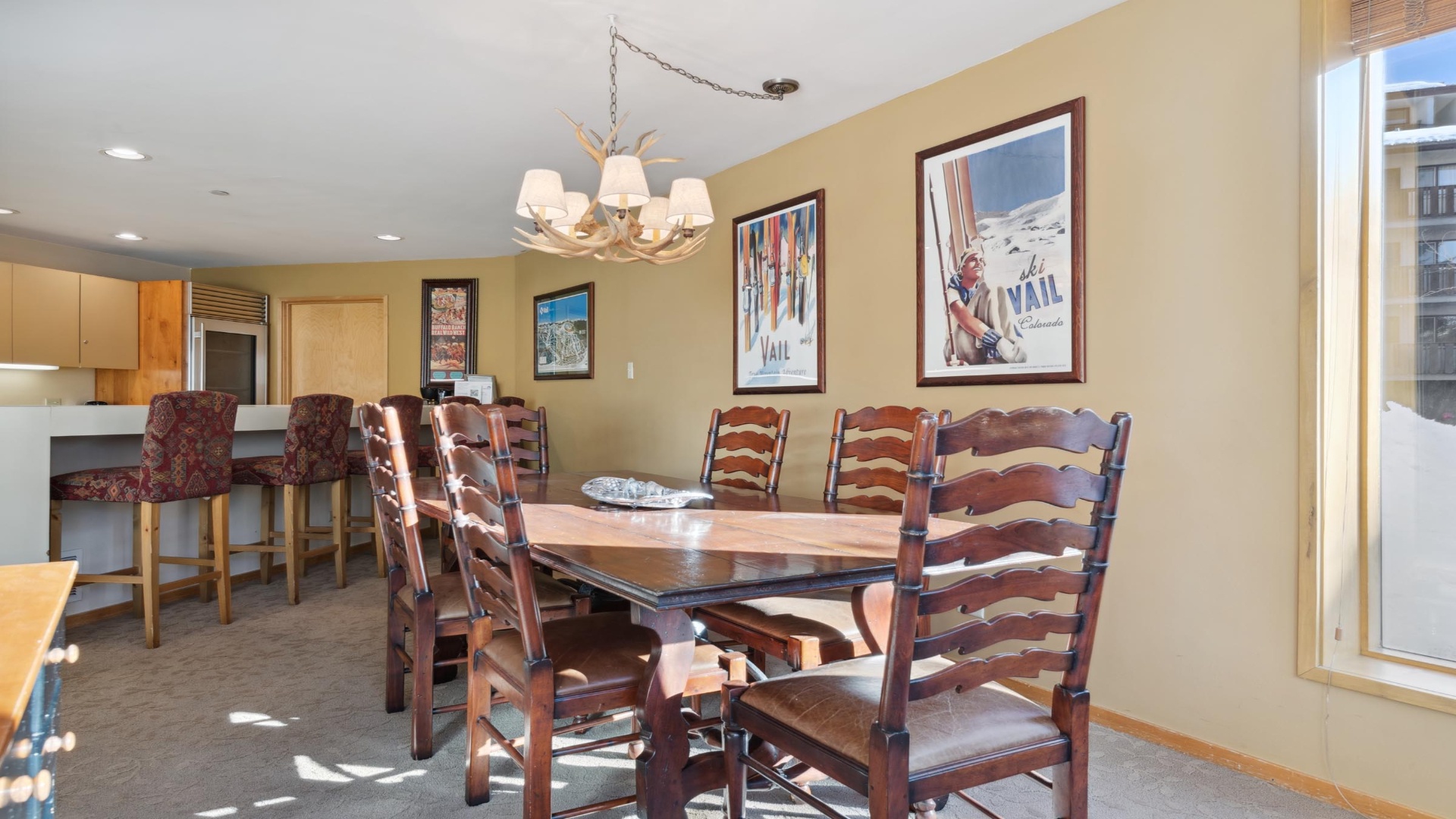 Gather with friends and family at this inviting dining space, where a rustic wooden table and comfortable seating set the stage for memorable meals together.