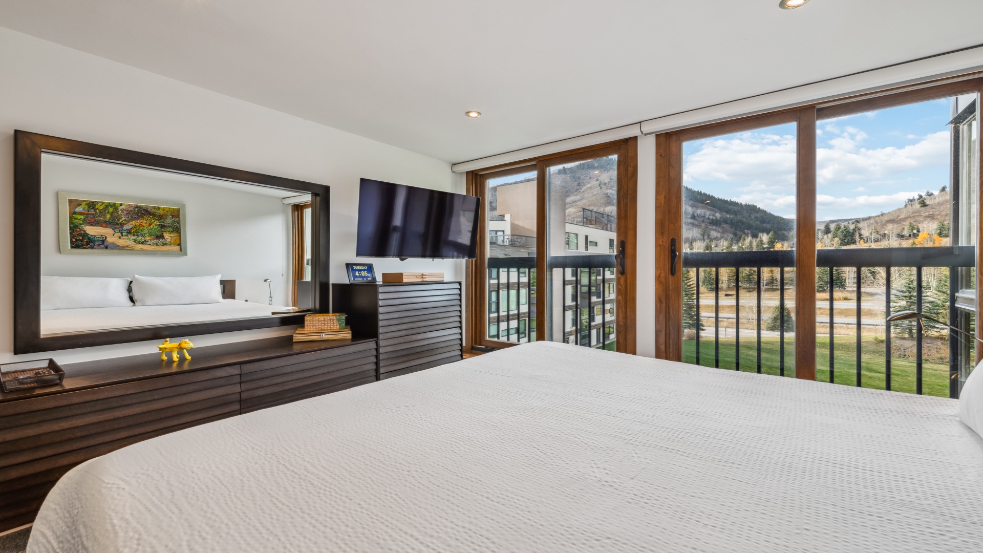 Wake up to stunning mountain views framed by expansive windows. Your private balcony invites fresh alpine air while sleek furnishings and modern comforts set the stage for total relaxation.