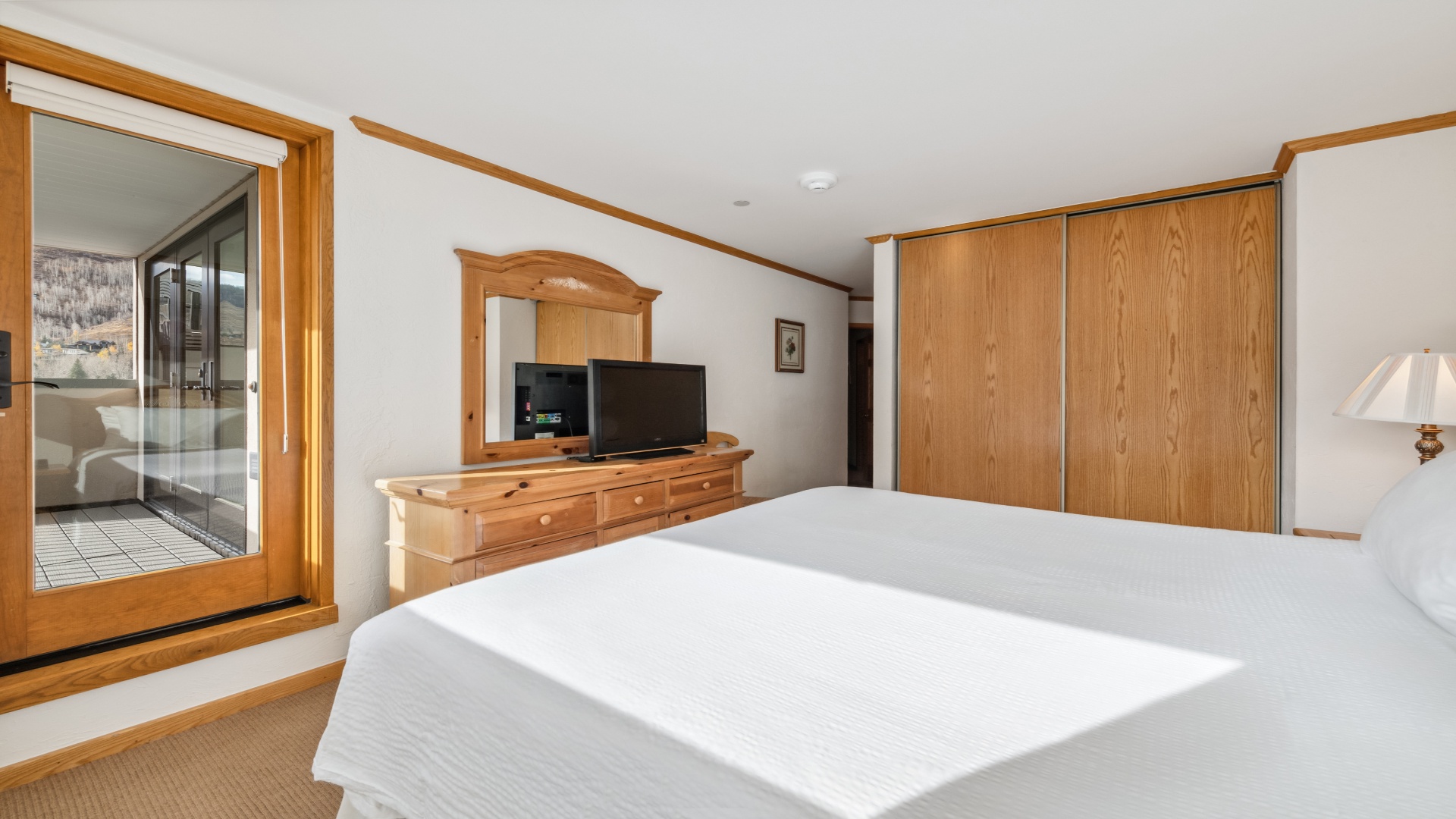 Sink into crisp linens and unwind in your serene bedroom, complete with a flat-screen TV and generous closet space for all your belongings.