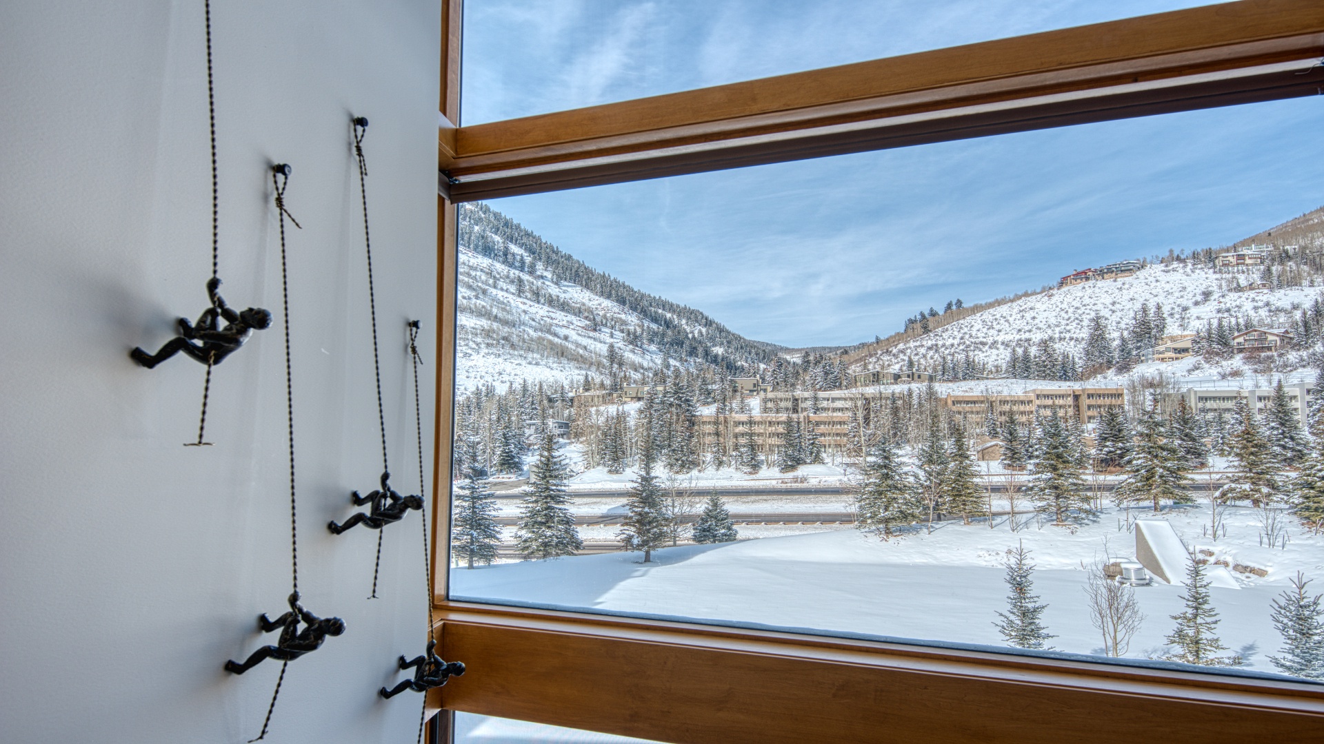 Enjoy breathtaking winter mountain views from your window, where snow-draped evergreens and pristine slopes create a peaceful alpine retreat.