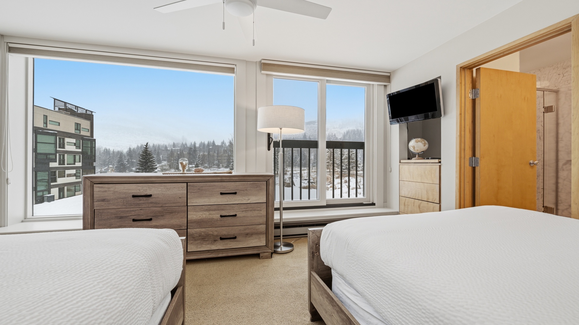 Wake up to serene mountain and forest views from your cozy twin bedroom. Bright, peaceful, and ready to welcome you for a restful retreat.