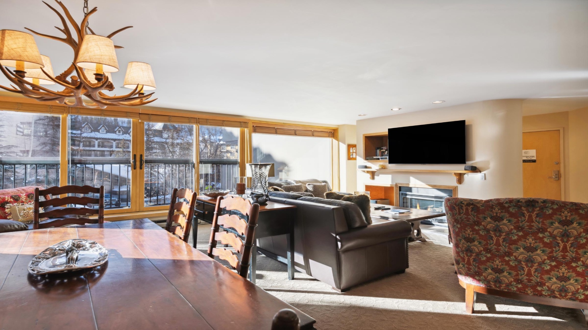 Relax in your spacious retreat where mountain views meet rustic elegance. Unwind by the fireplace or gather around the dining table after a day exploring nearby slopes.