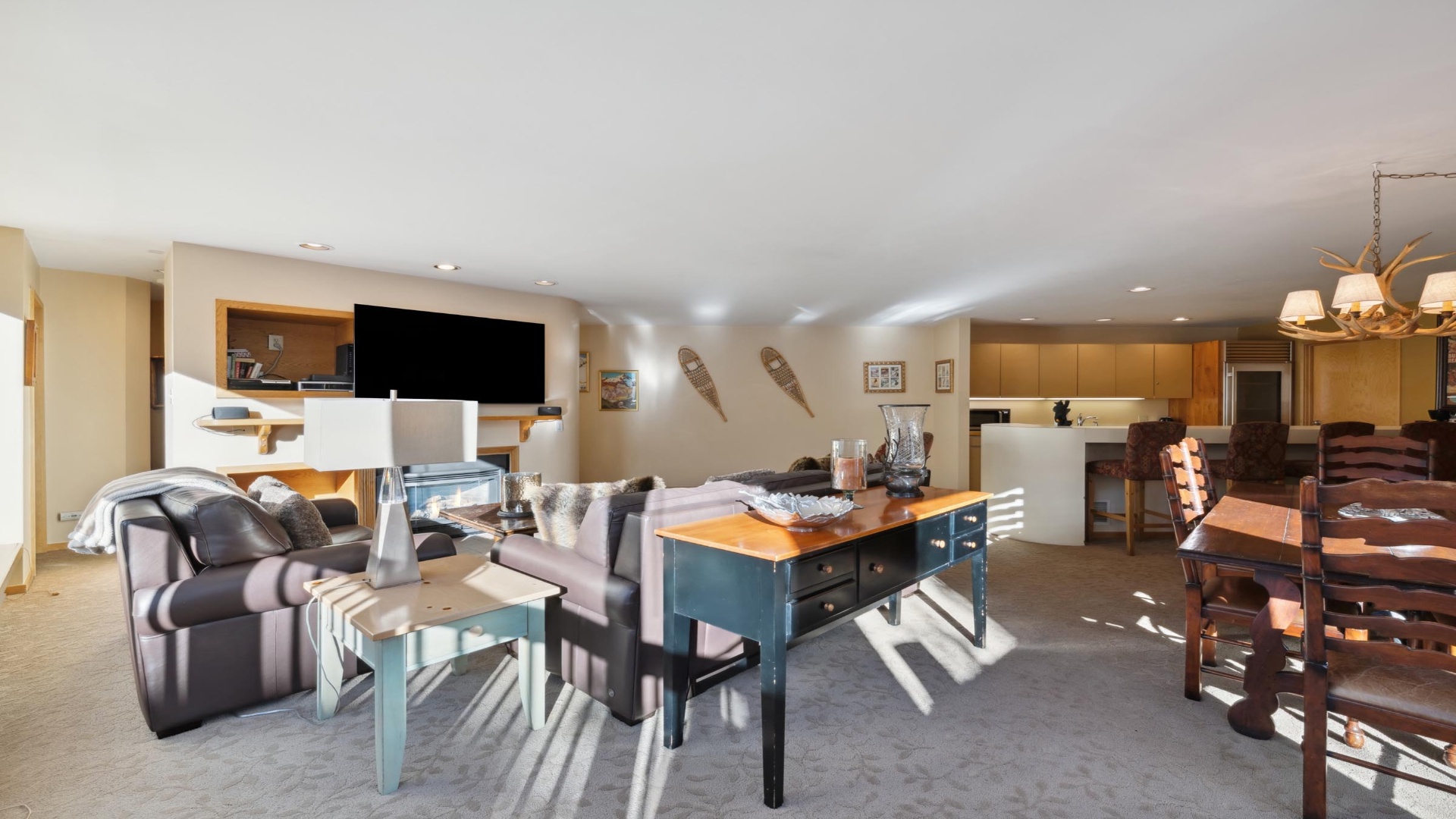 Sink into the plush seating and enjoy your favorite shows on the wall-mounted TV while natural light streams in, creating a bright and inviting retreat.