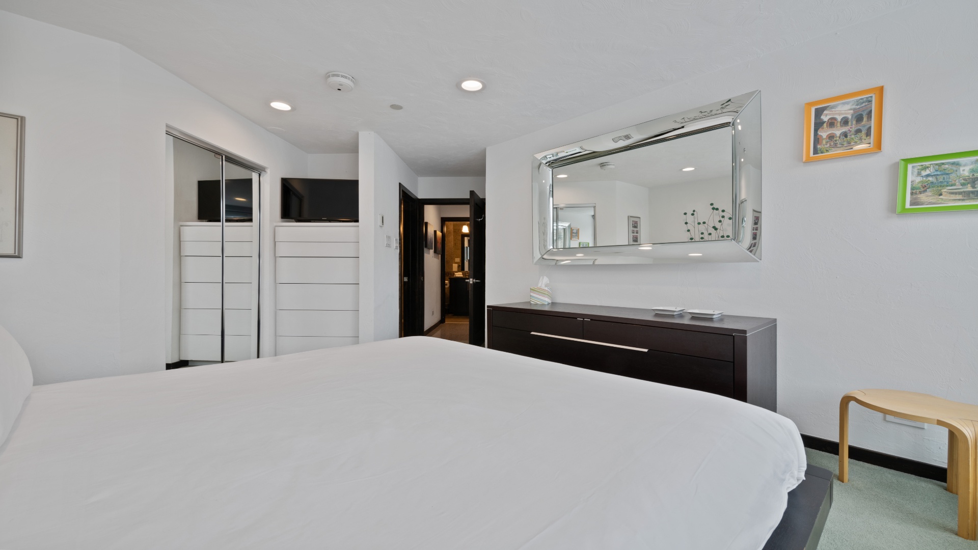 Unwind in your sleek, modern bedroom with plush bedding, ample closet space, and contemporary furnishings designed for your ultimate comfort and relaxation.