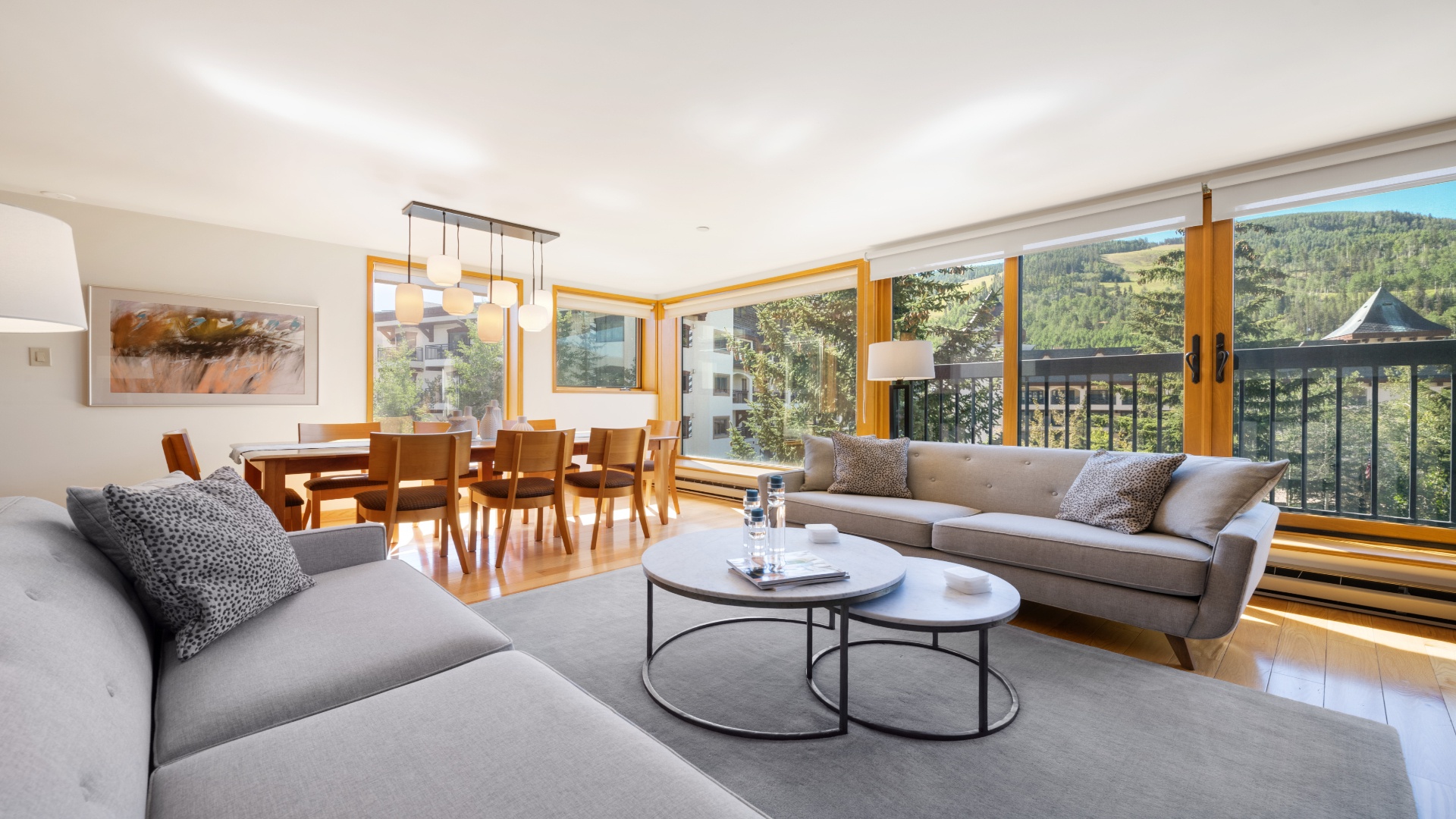 Sink into plush sofas and take in stunning mountain views through expansive windows. Your open-plan living and dining space invites relaxation and memorable gatherings with loved ones.