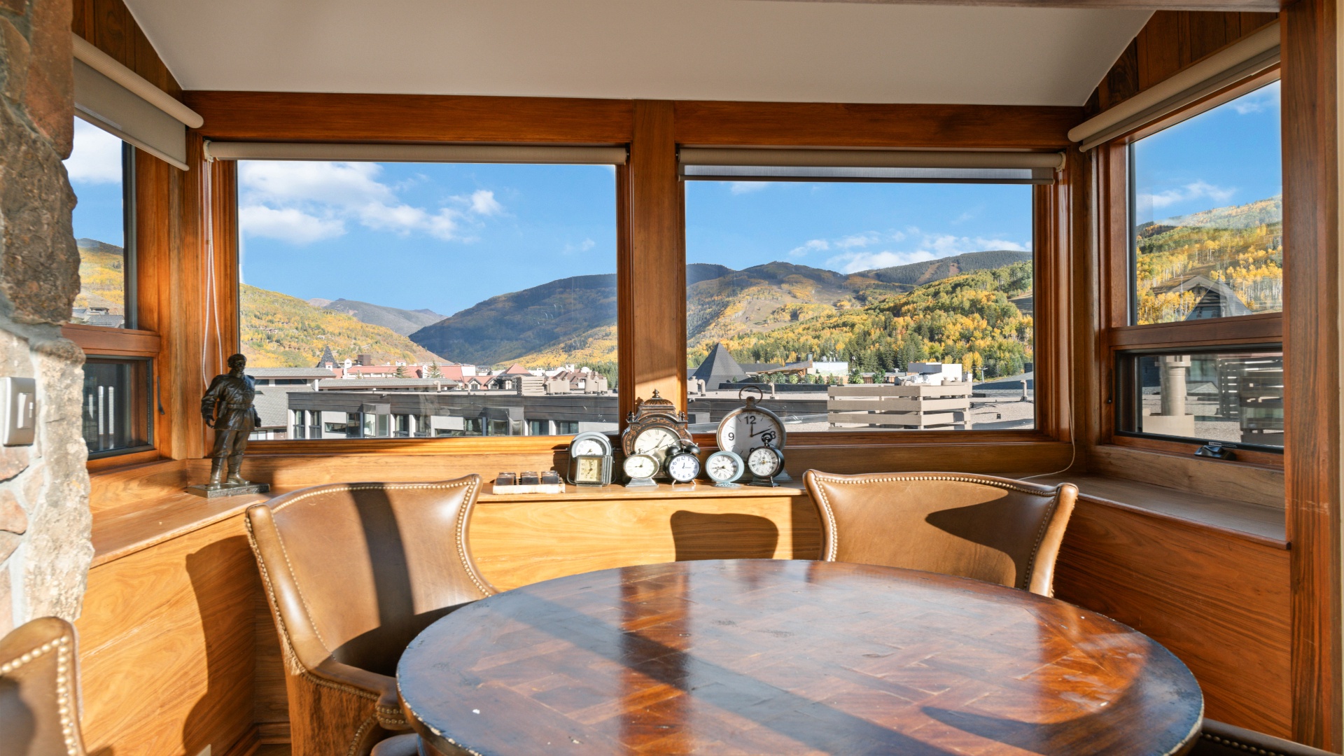 Gather around this warm wood dining nook with sweeping mountain and valley views—your perfect spot for morning coffee or evening relaxation.
