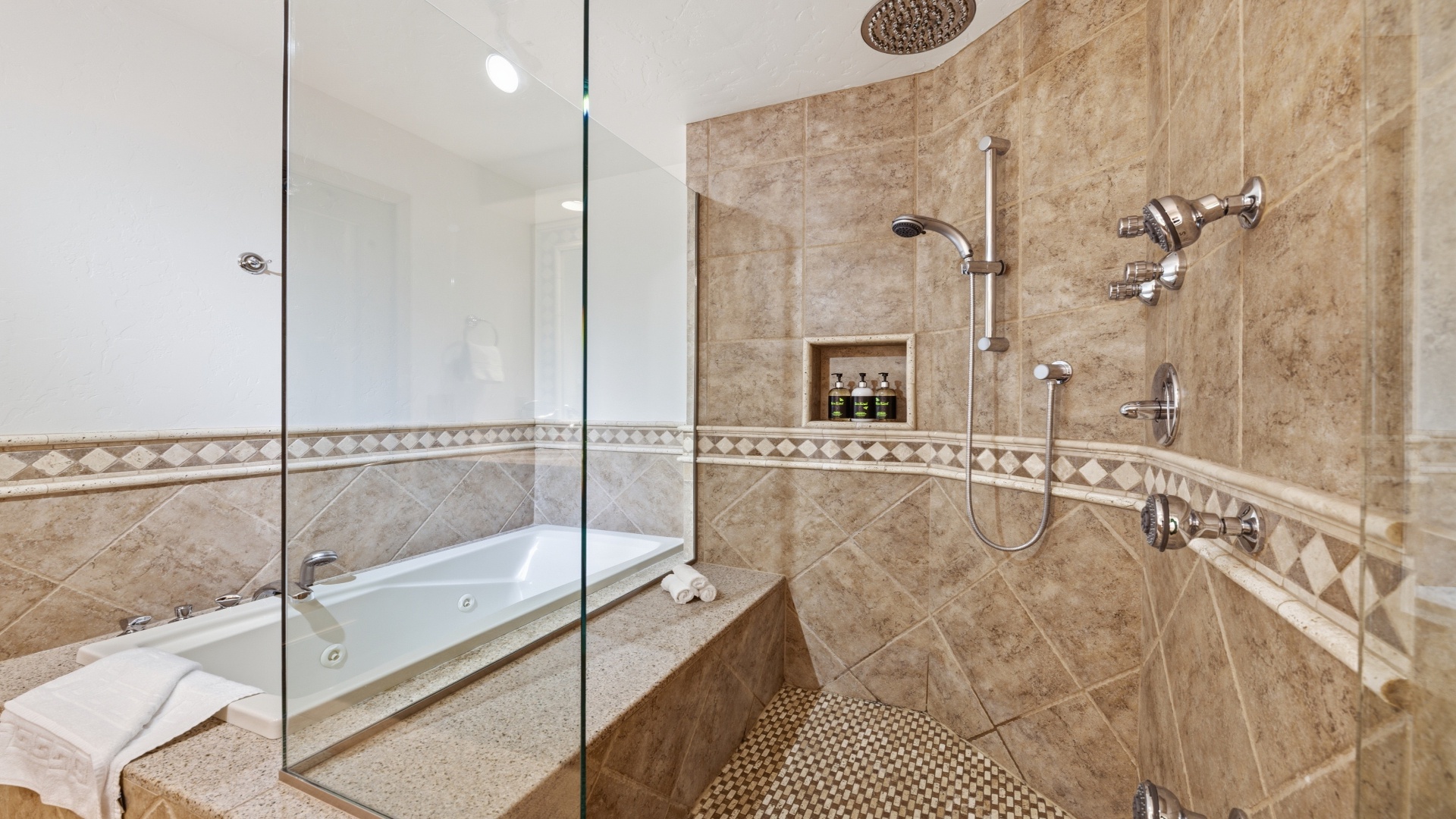 Unwind in your spacious bathroom with a walk-in shower featuring dual showerheads and a soothing jetted tub—your private sanctuary for relaxation.
